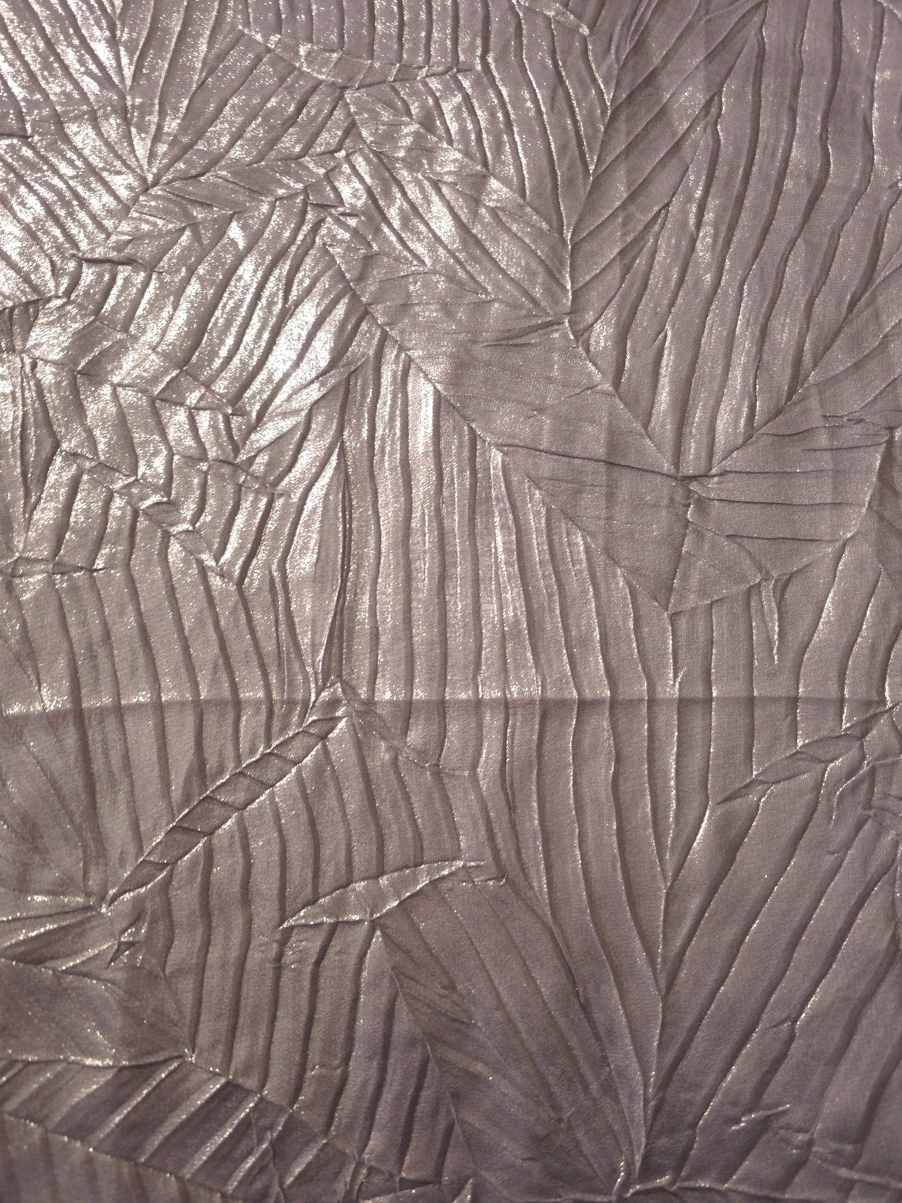 Surface detail of Lavender Taupe leaf-pattern plissé shimmer fabric showcases sculpted leaf-like pleats for evening clutches, garment accents and special-occasion pieces.