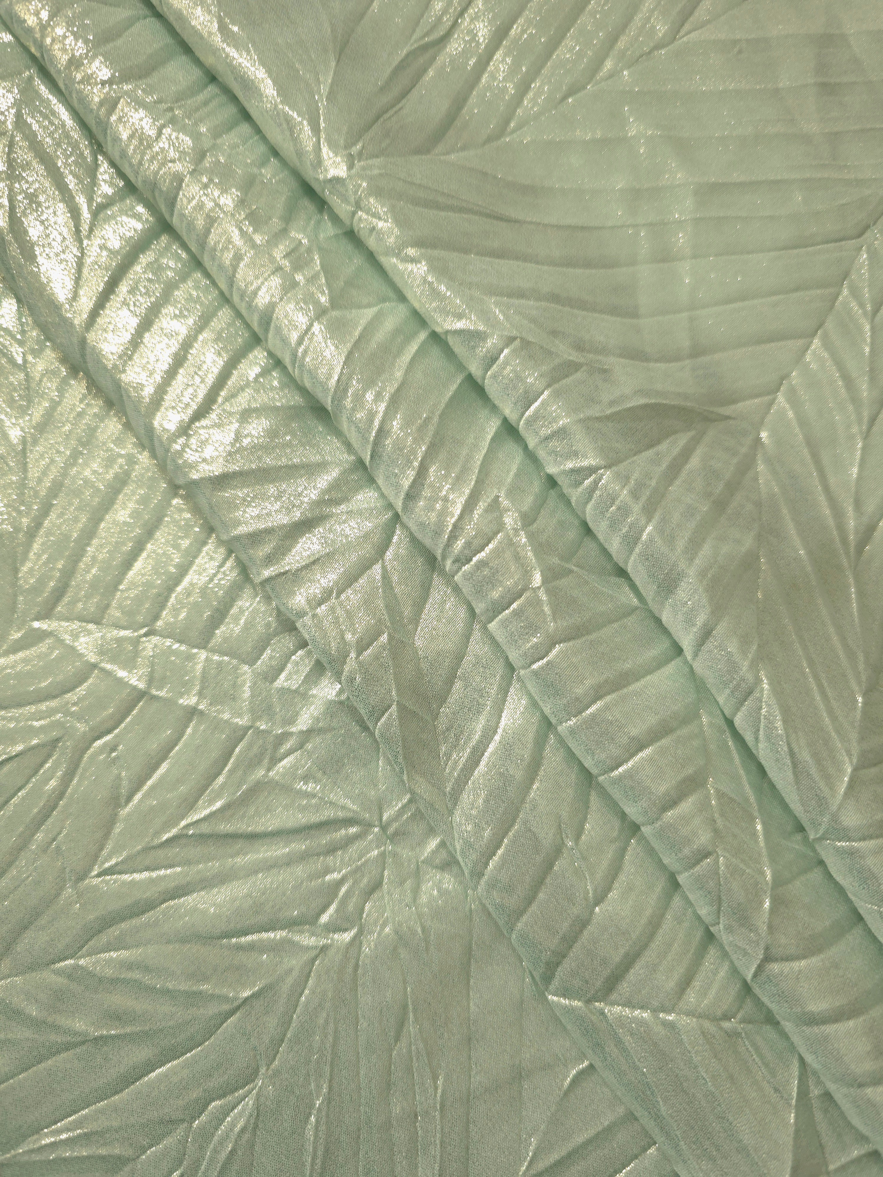 Pale Sage leaf-pattern plissé fabric in close detail, revealing the fine shimmer and dimensional pleat structure suited to bodice accents and fashion-forward blouses.