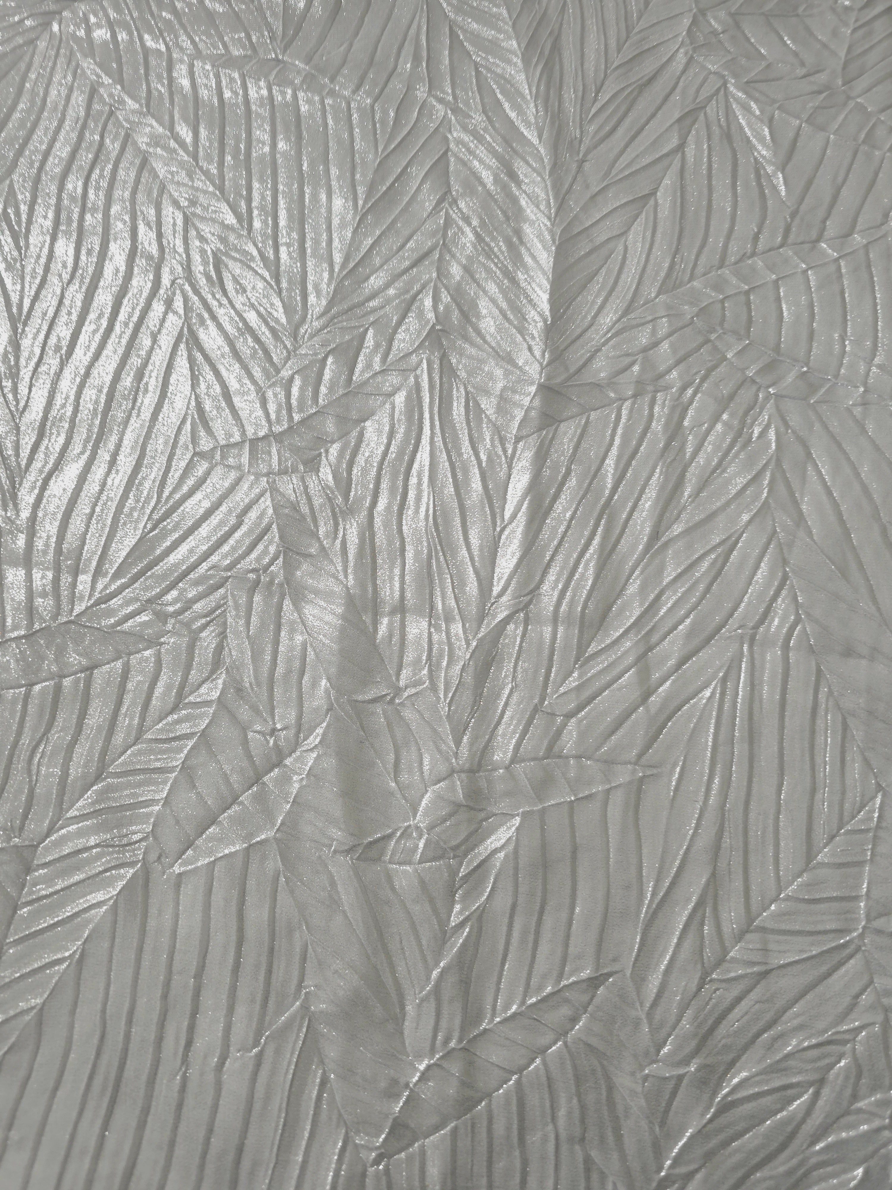 Surface detail of Pearl Silver leaf-pattern plissé shimmer fabric showcases sculpted leaf-like pleats for evening clutches, garment accents and special-occasion pieces.
