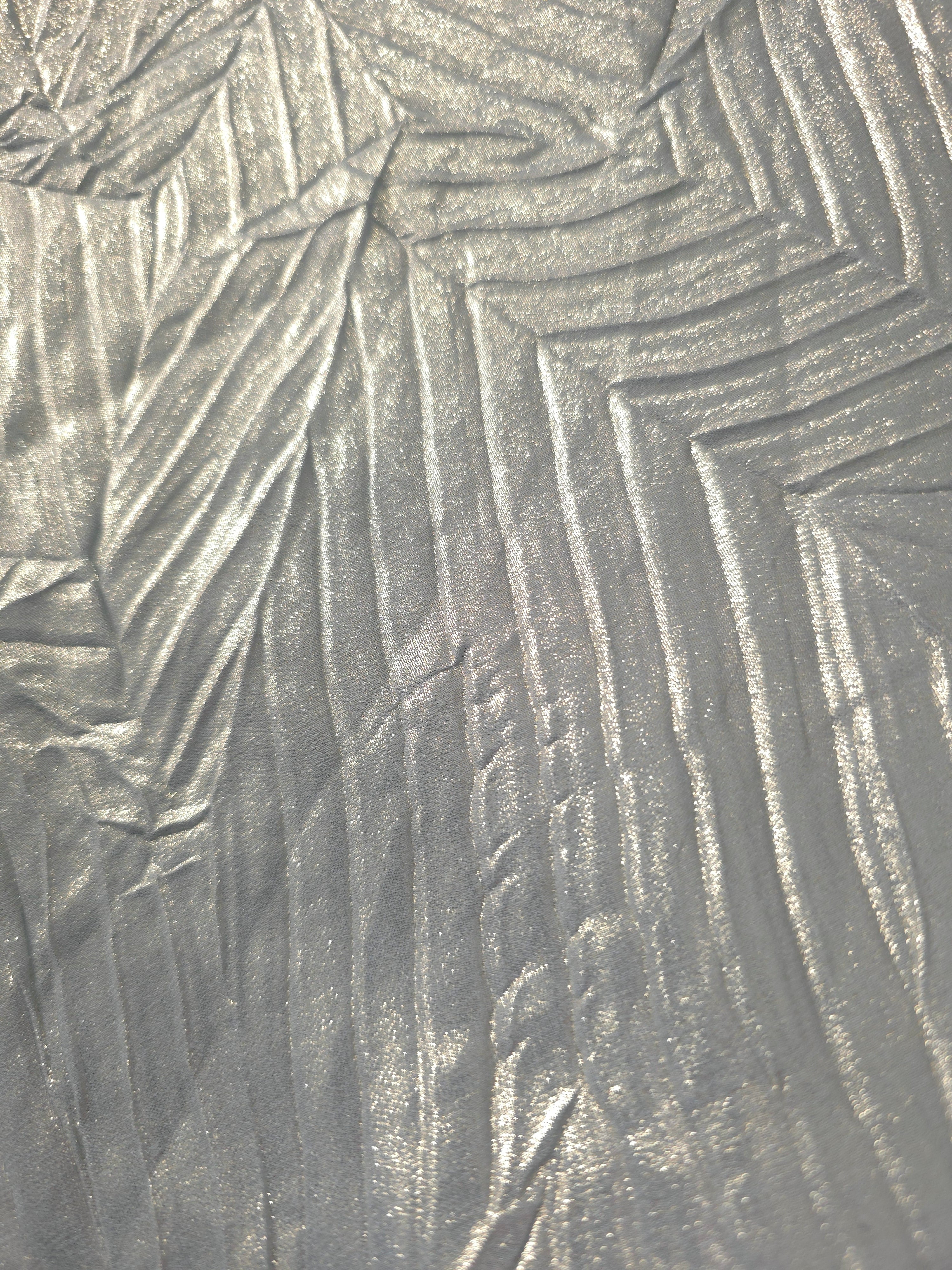 Soft drape of Pewter Gray textured shimmer plissé reveals dimensional folds and shifting reflection for jumpsuits and fluid occasionwear.