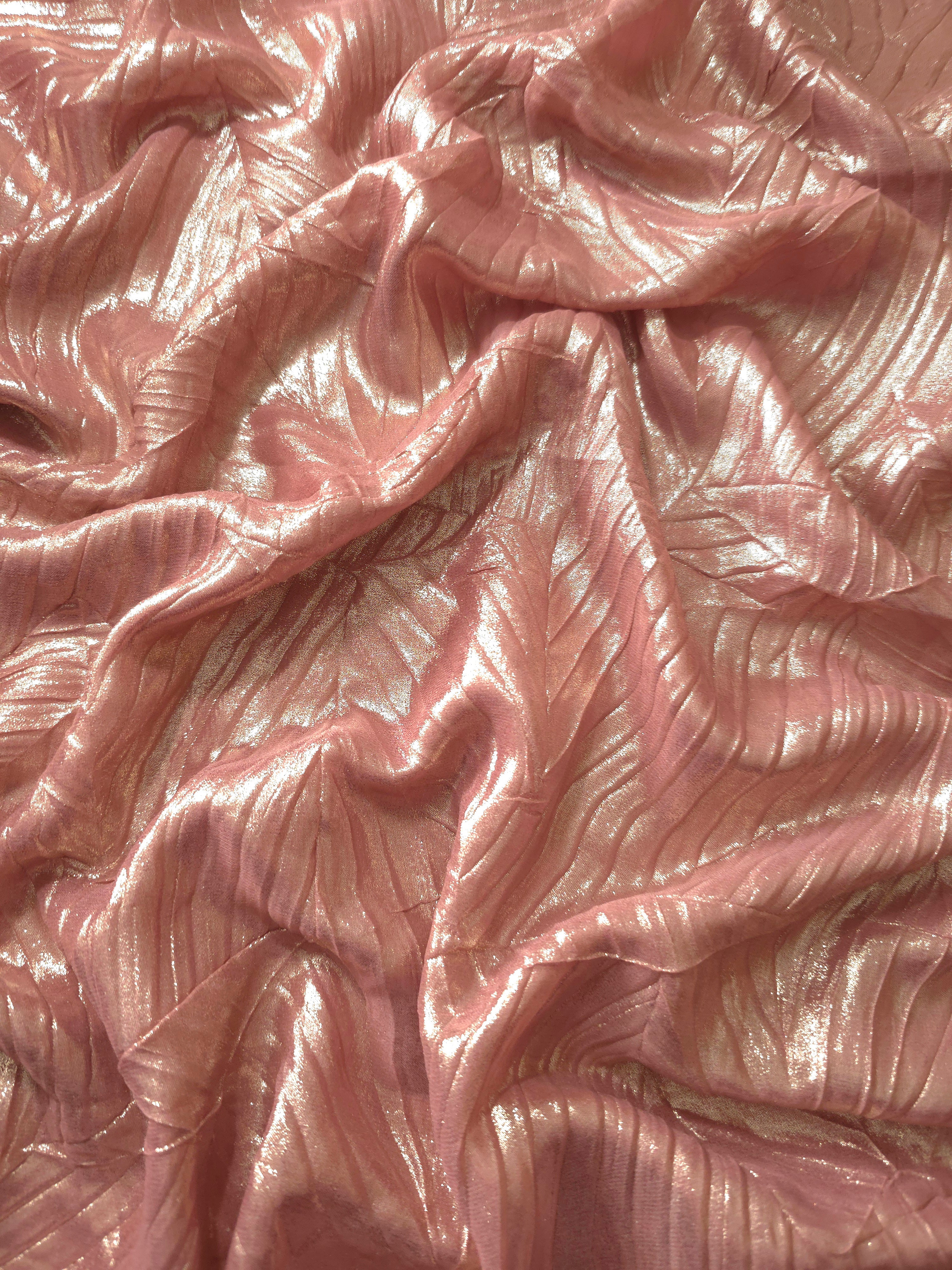 Flowing drape of Rose Taupe leaf-pattern plissé shimmer fabric, showing sculpted leaf-like pleats and light-catching movement for evening gowns and flowing maxi skirts.