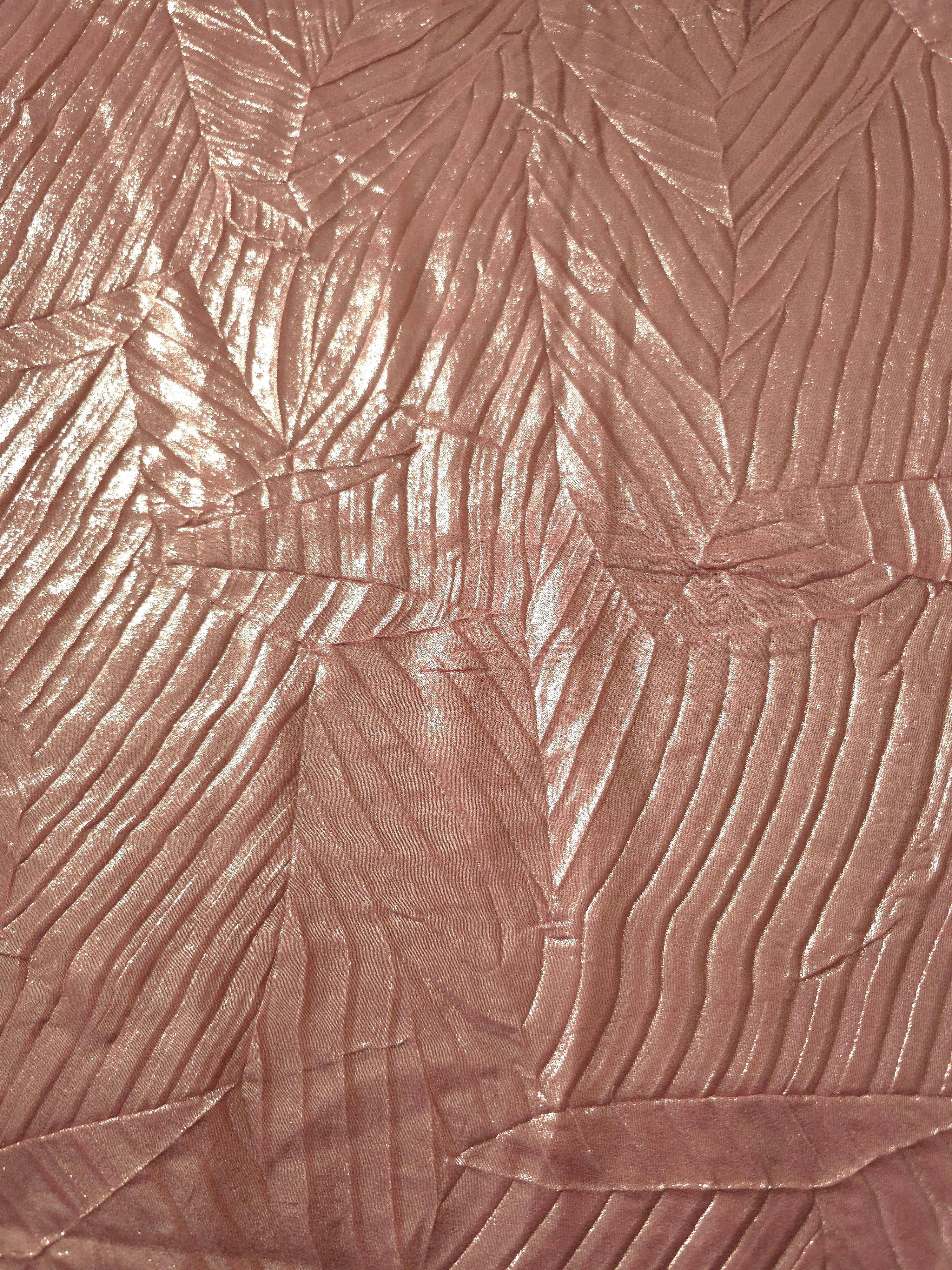 Surface detail of Rose Taupe leaf-pattern plissé shimmer fabric showcases sculpted leaf-like pleats for evening clutches, garment accents and special-occasion pieces.