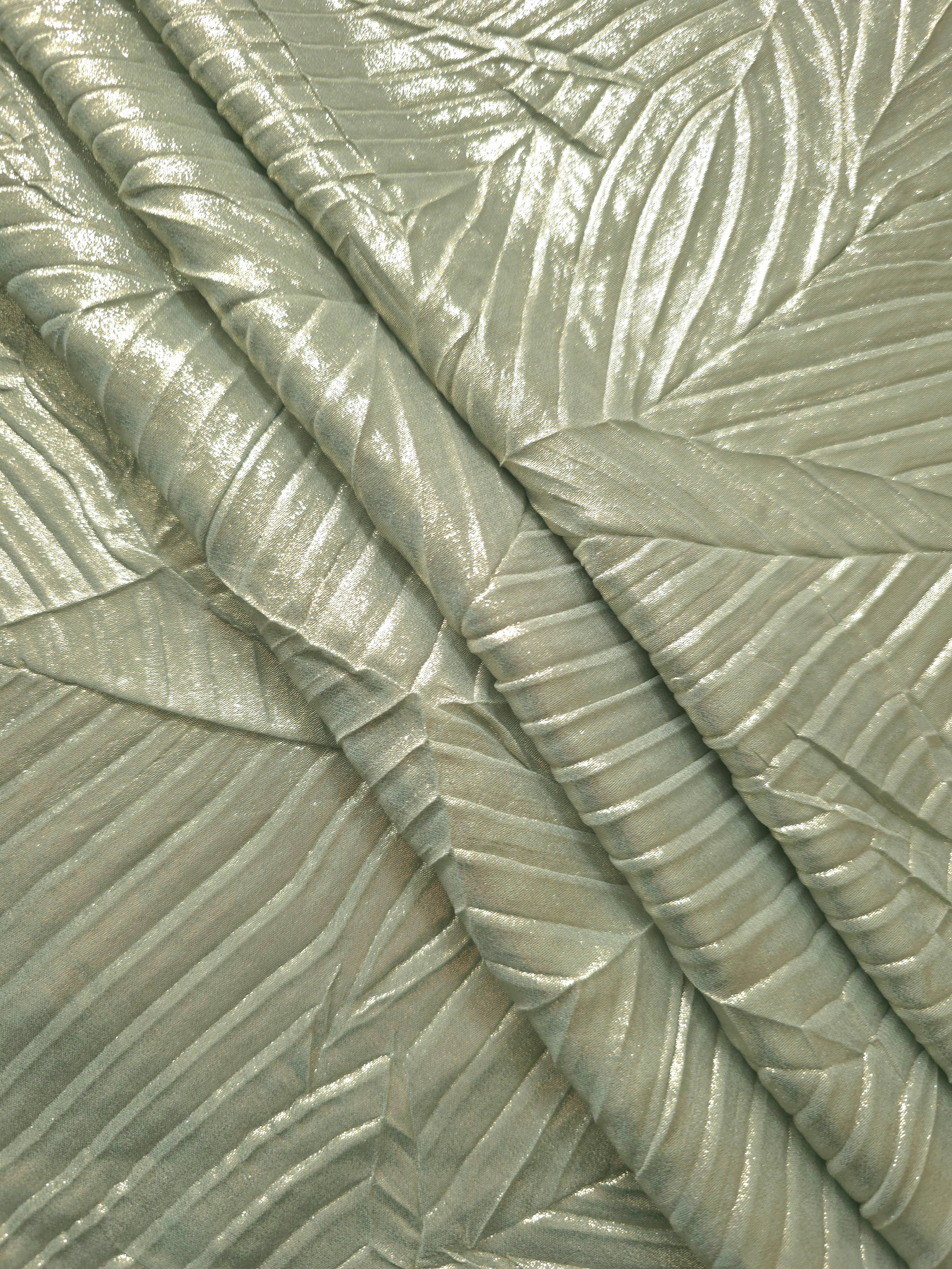 Sage Gray leaf-pattern plissé fabric in close detail, revealing the fine shimmer and dimensional pleat structure suited to bodice accents and fashion-forward blouses.