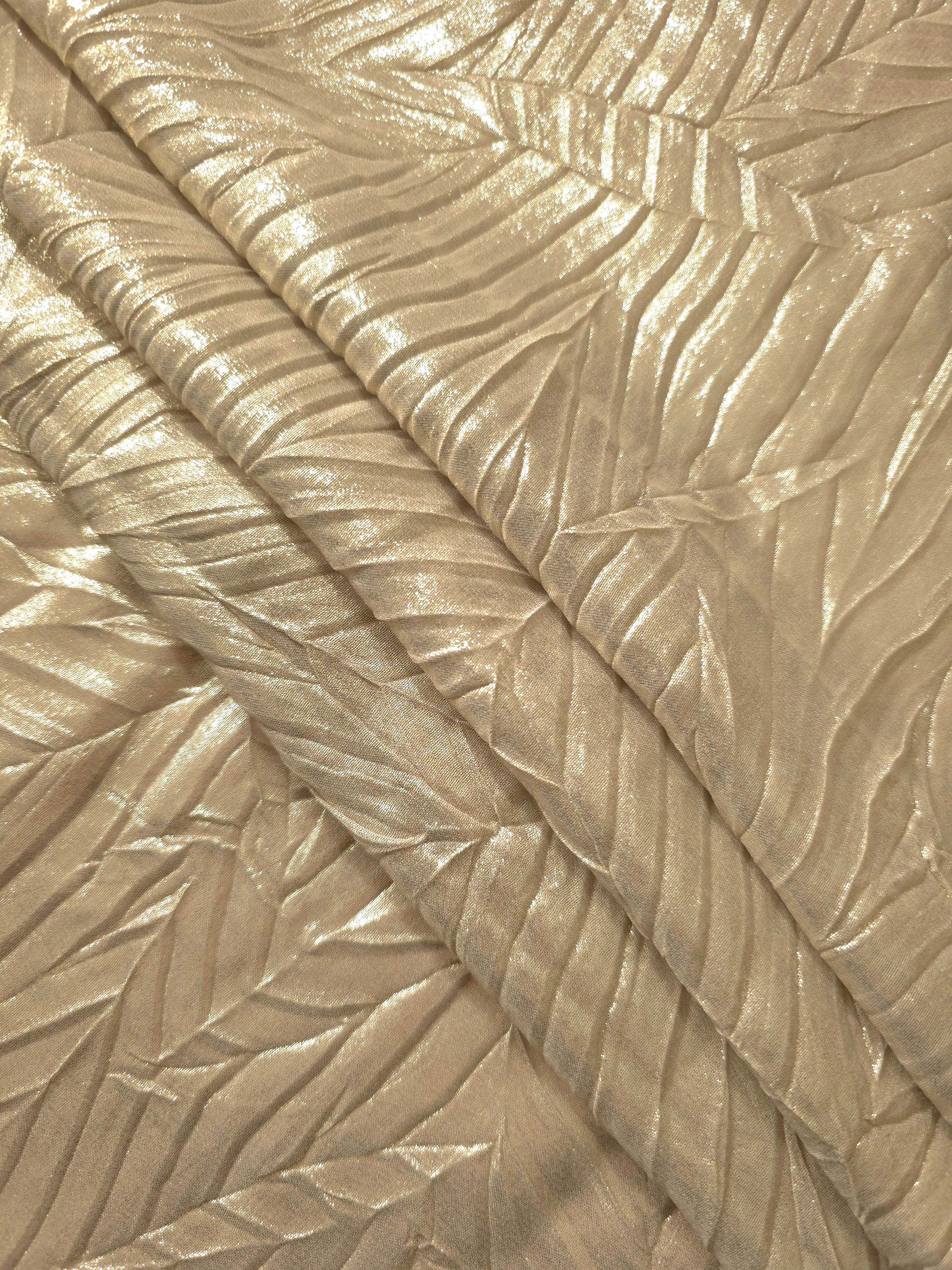 Soft Champagne leaf-pattern plissé fabric in close detail, revealing the fine shimmer and dimensional pleat structure suited to bodice accents and fashion-forward blouses.