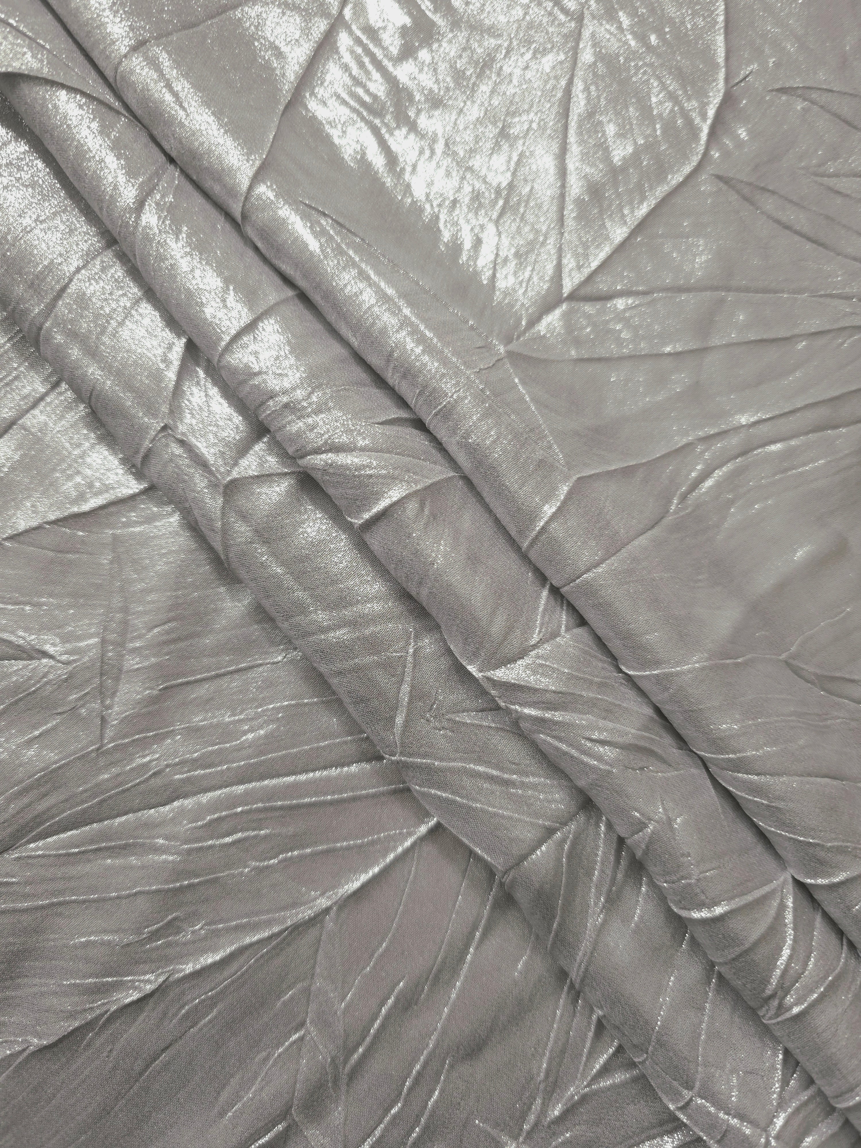 Steel Silver leaf-pattern plissé fabric in close detail, revealing the fine shimmer and dimensional pleat structure suited to bodice accents and fashion-forward blouses.
