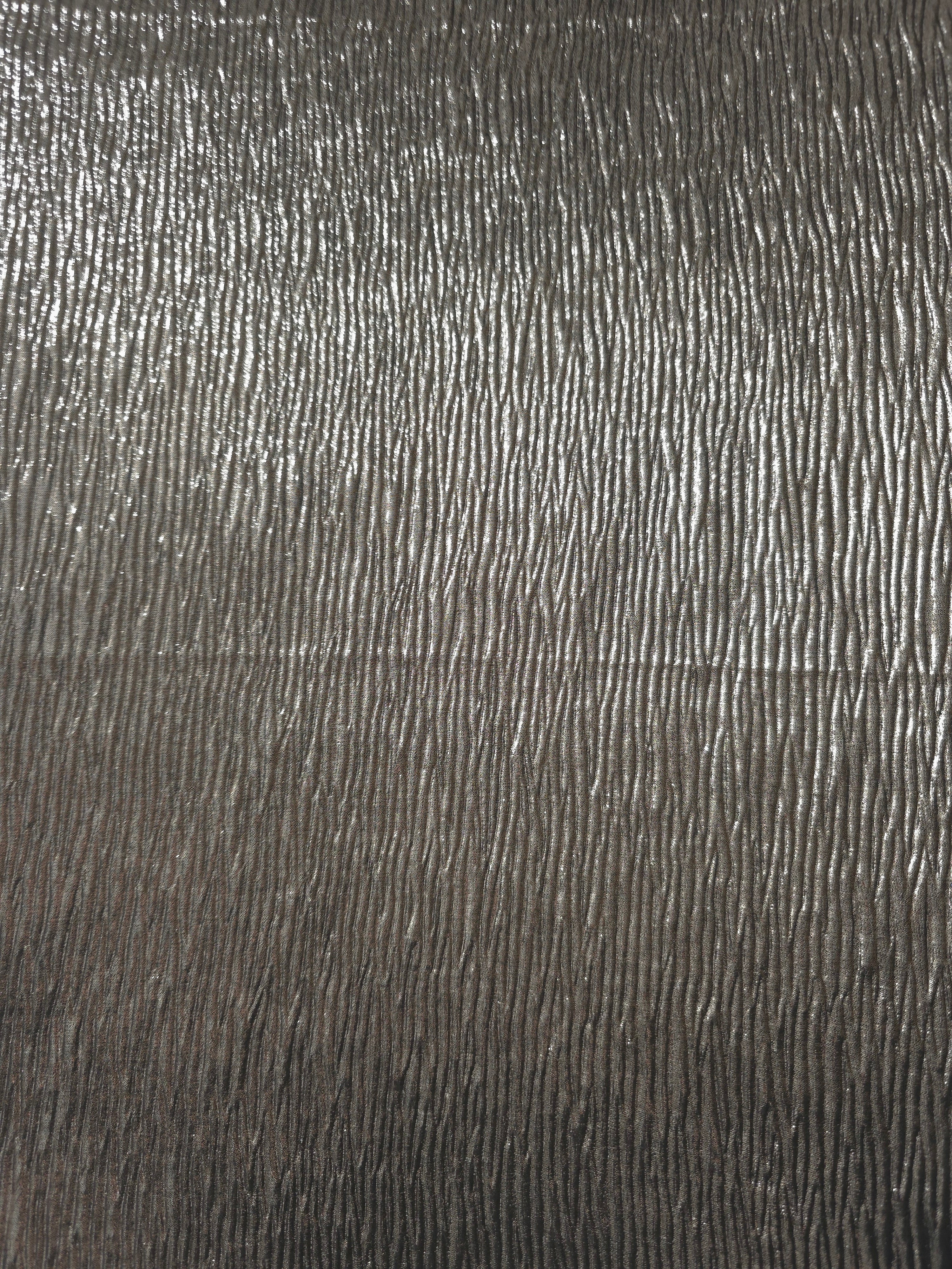 Surface detail of Graphite Gray fine mini-plissé shimmer fabric showcases narrow micro-pleated texture for evening clutches, garment accents and special-occasion pieces.