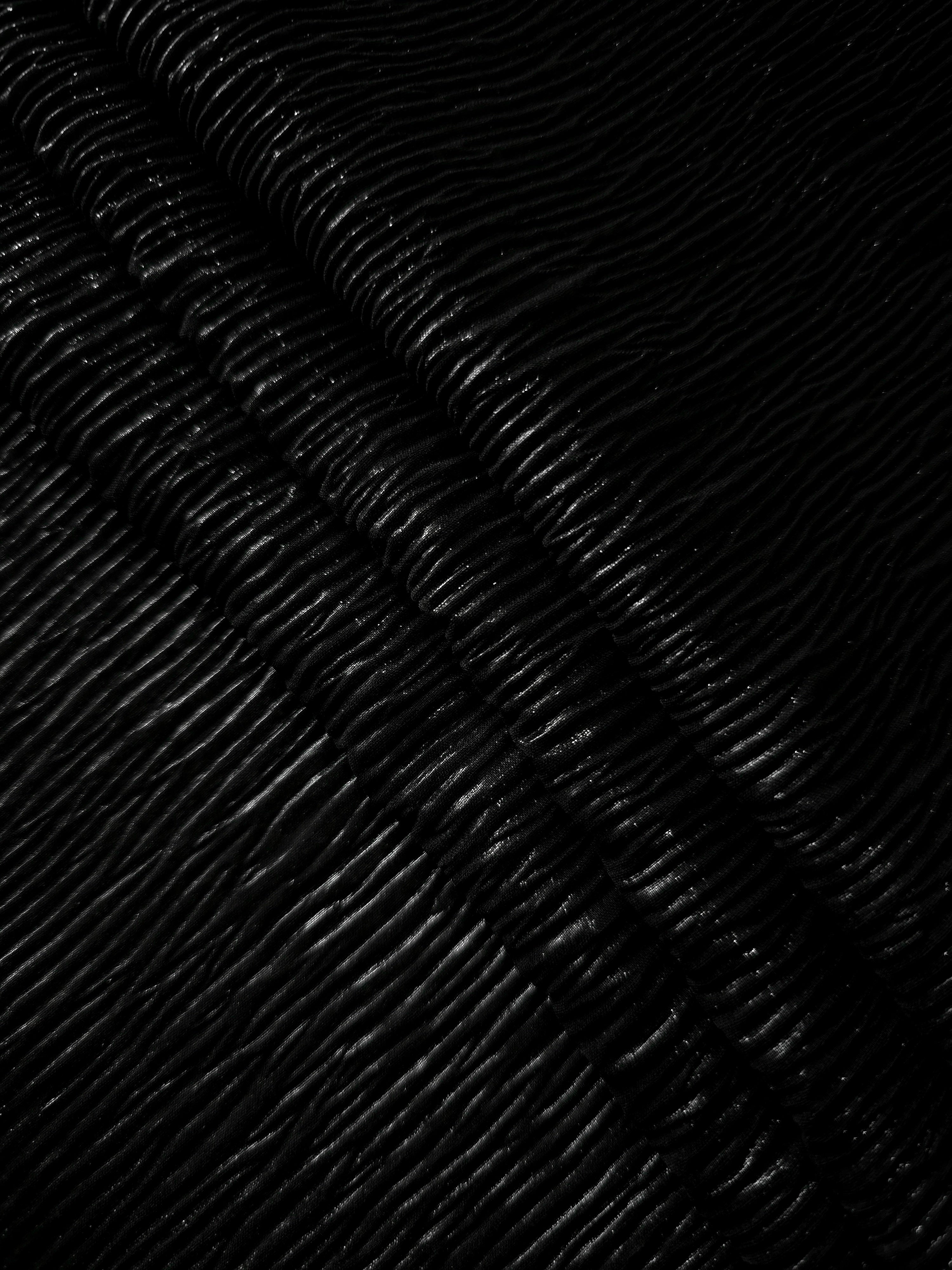 Jet Black fine mini-plissé fabric in close detail, revealing the fine shimmer and dimensional pleat structure suited to bodice accents and fashion-forward blouses.
