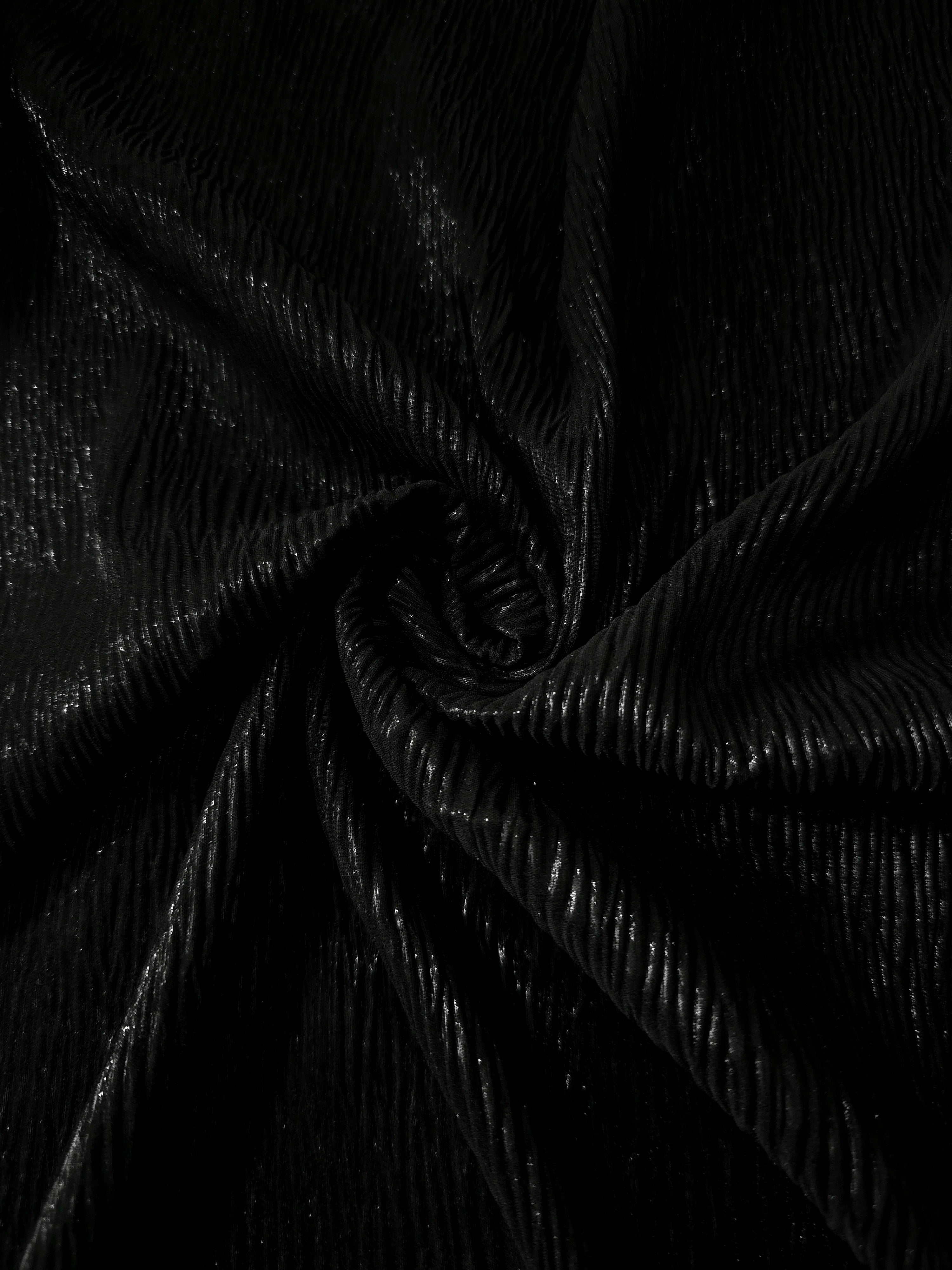 Jet Black shimmer plissé shown in a broad view, making the pleat pattern and visual rhythm clear for dancewear, stage costumes and longline silhouettes.