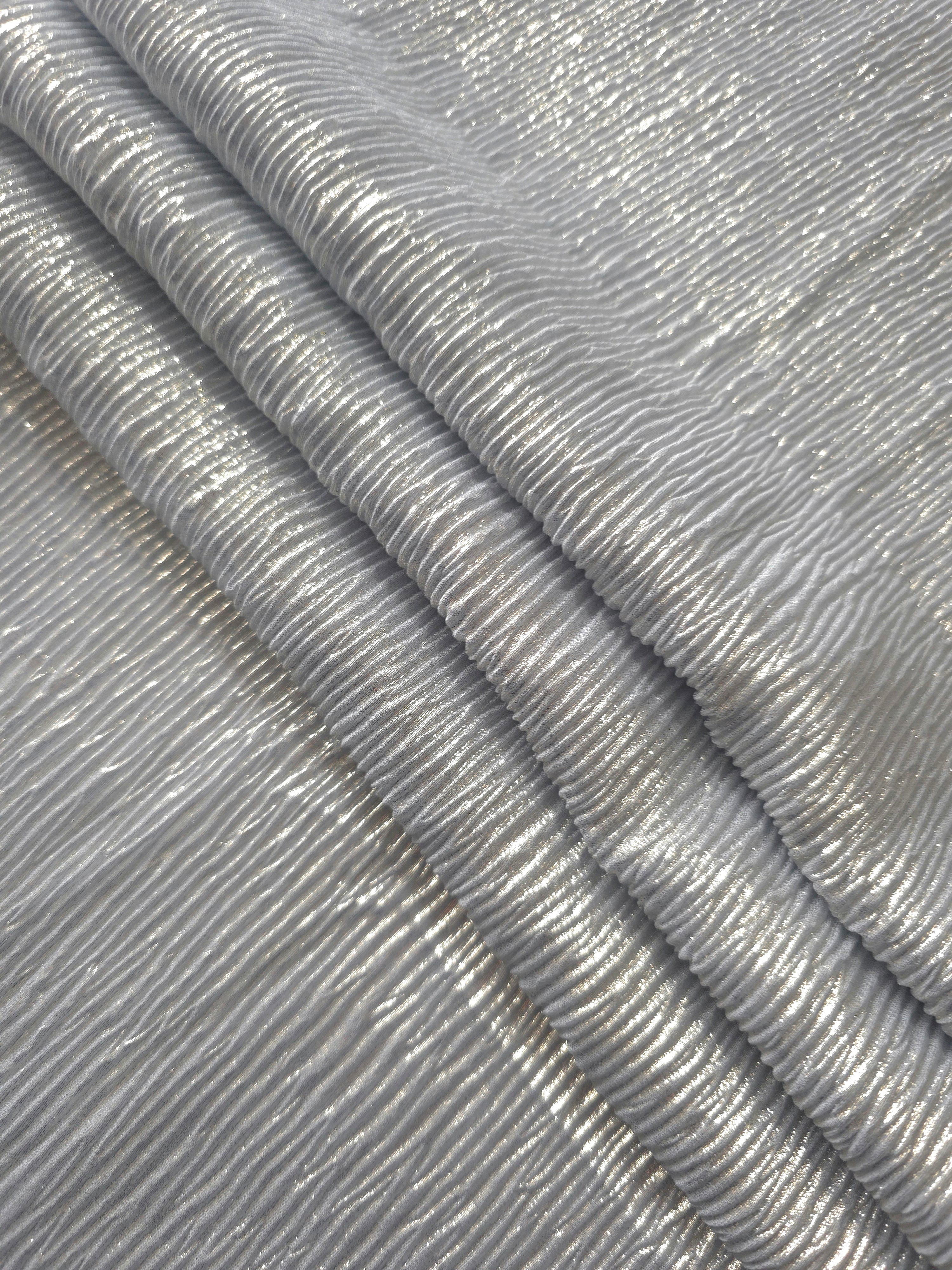Soft drape of Pewter Gray textured shimmer plissé reveals dimensional folds and shifting reflection for formal tops and draped skirt designs.