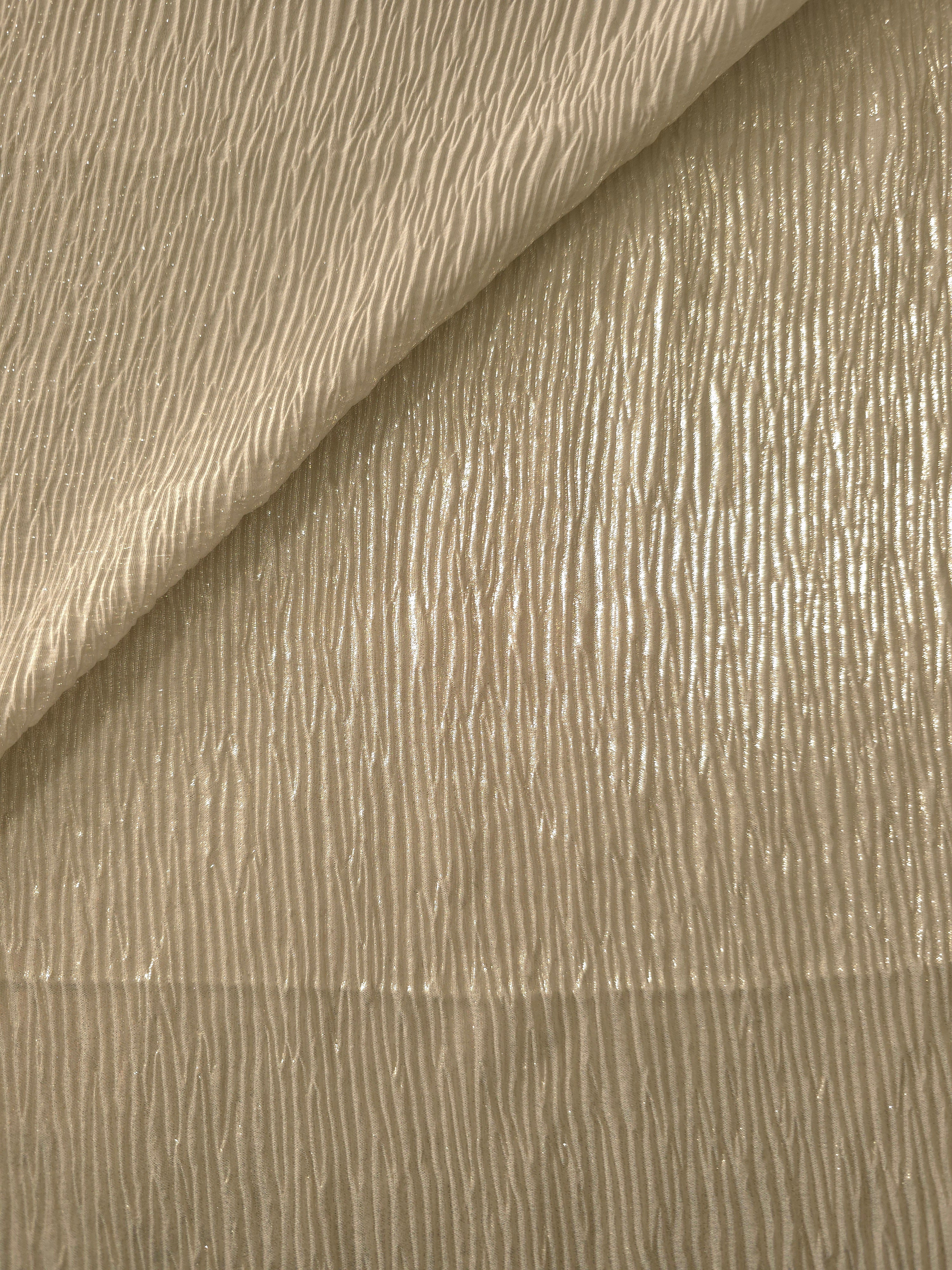 Soft Champagne shimmer plissé shown in a broad view, making the pleat pattern and visual rhythm clear for dancewear, stage costumes and longline silhouettes.