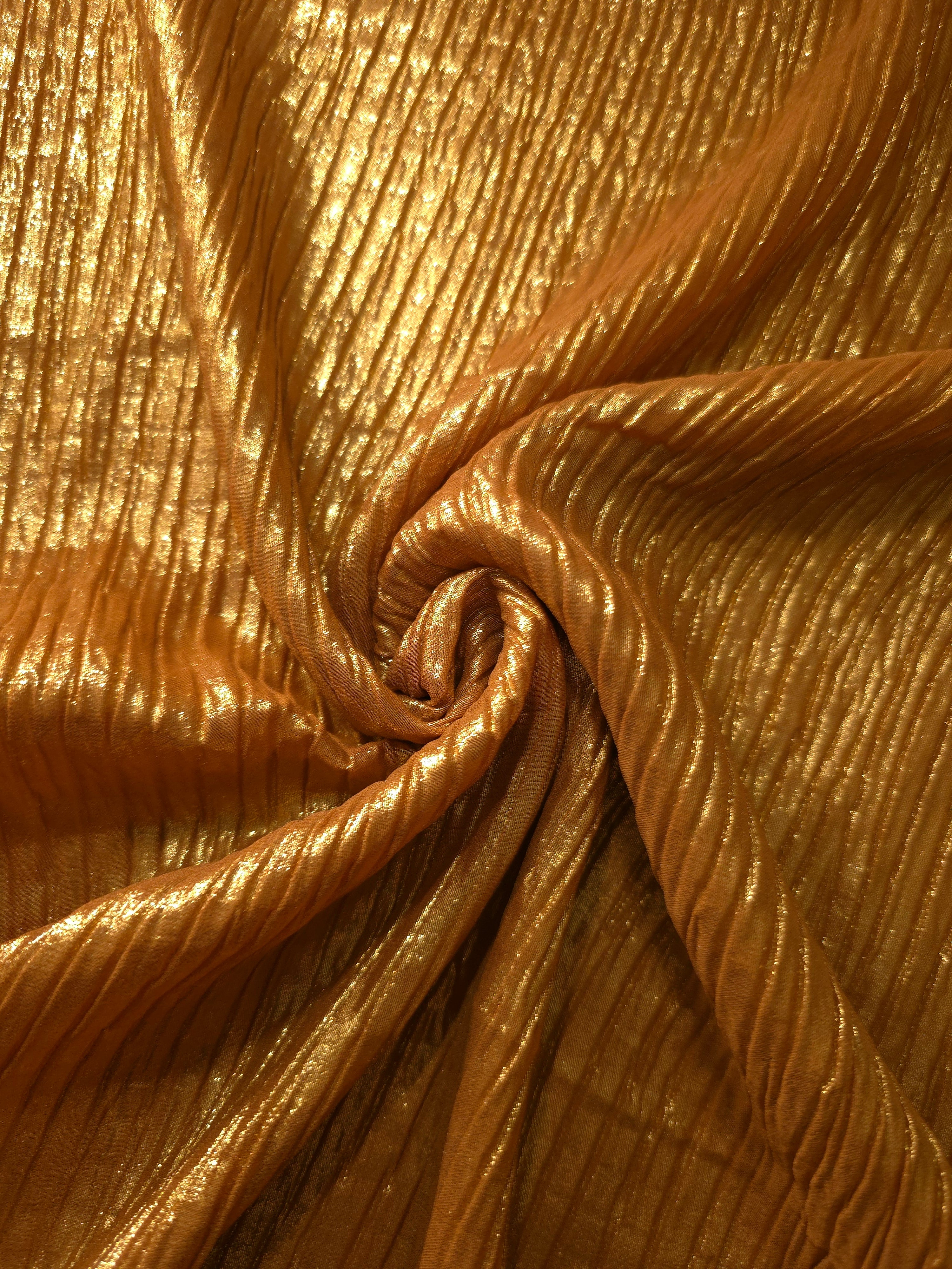 Amber Gold shimmer plissé shown in a broad view, making the pleat pattern and visual rhythm clear for blouses, skirts and fashion-forward layering pieces.