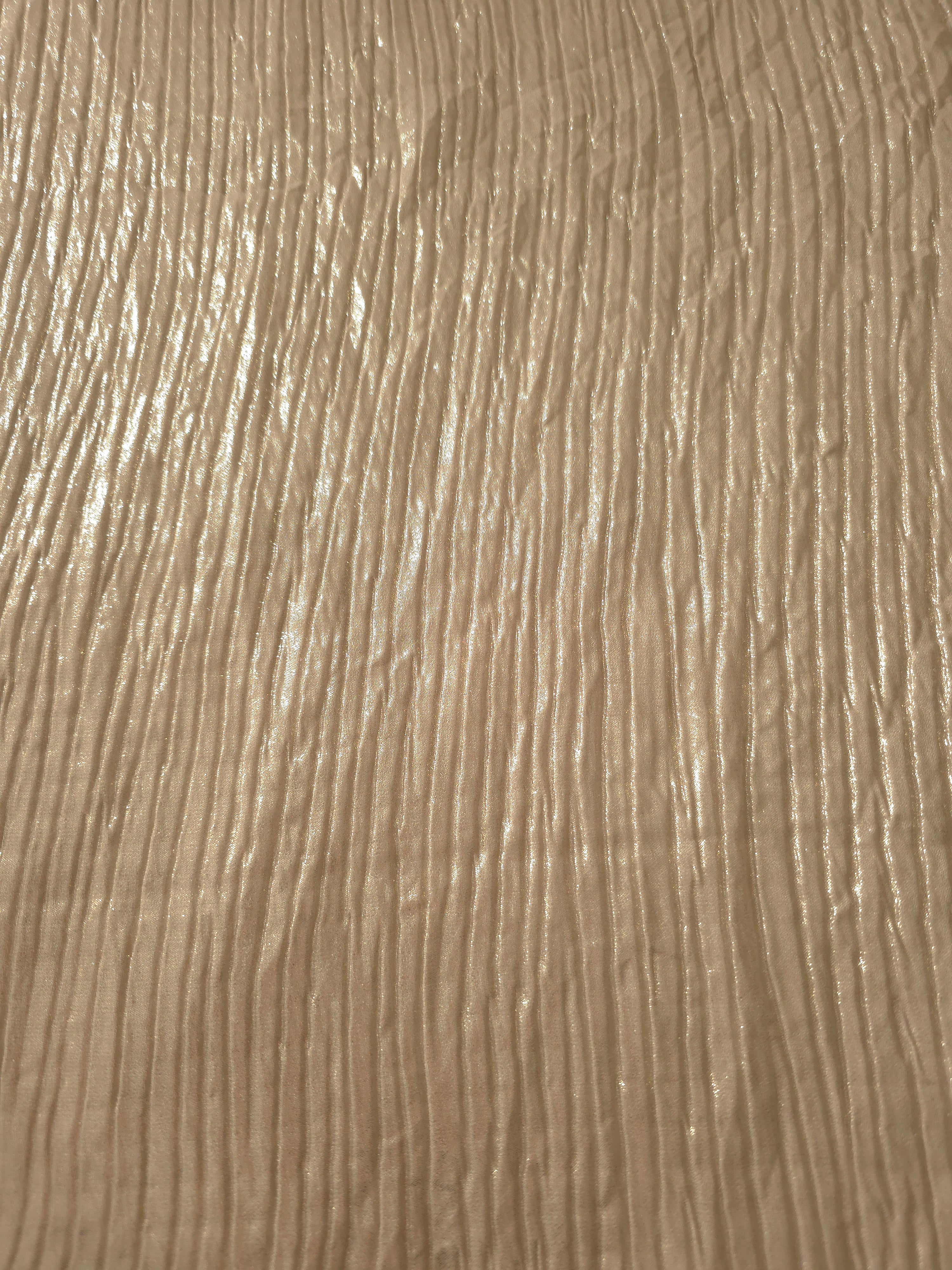 Surface detail of Champagne Beige classic plissé shimmer fabric showcases regular pleated texture for evening clutches, garment accents and special-occasion pieces.