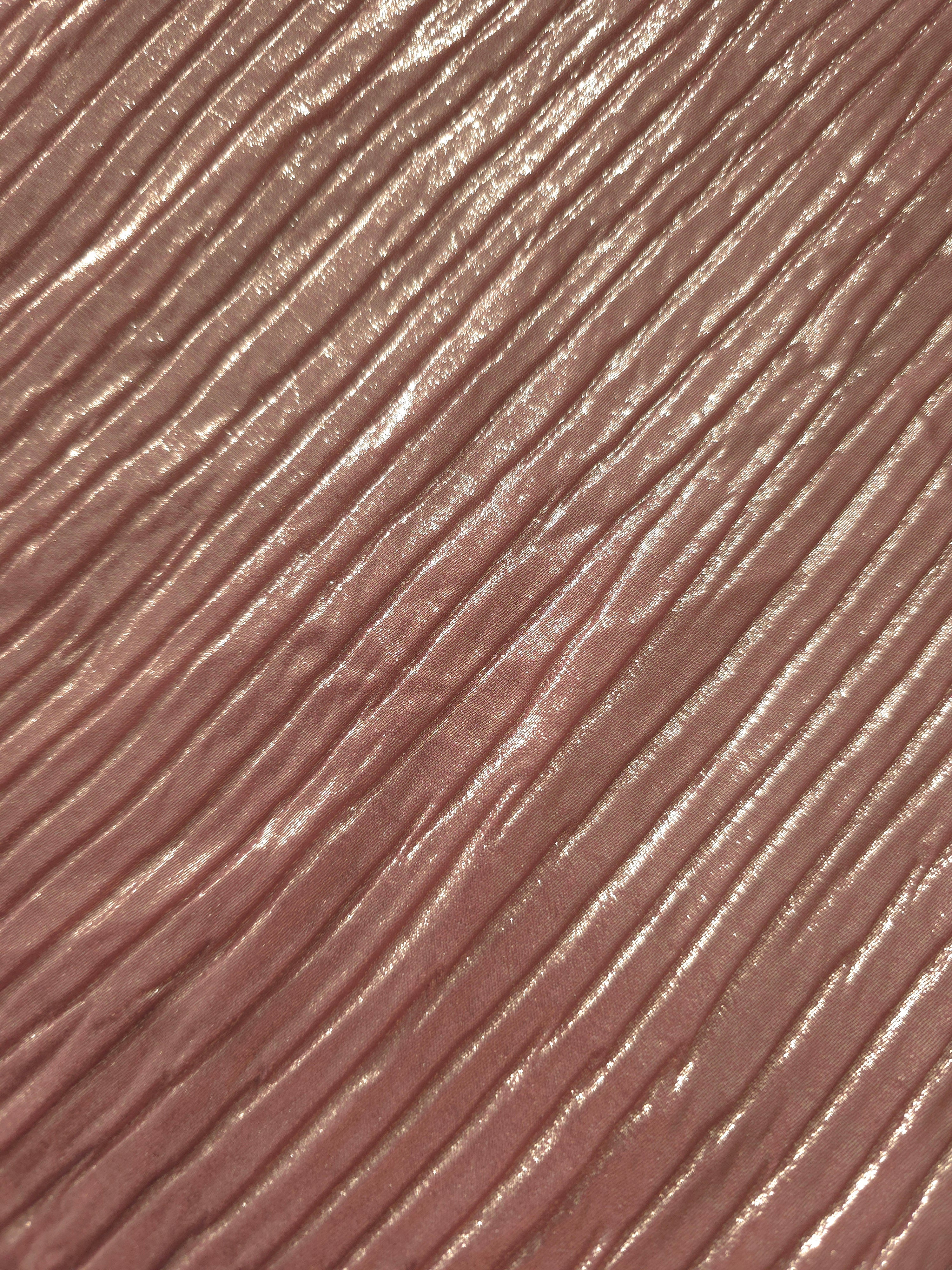 Soft drape of Dusty Rose textured shimmer plissé reveals dimensional folds and shifting reflection for jumpsuits and fluid occasionwear.