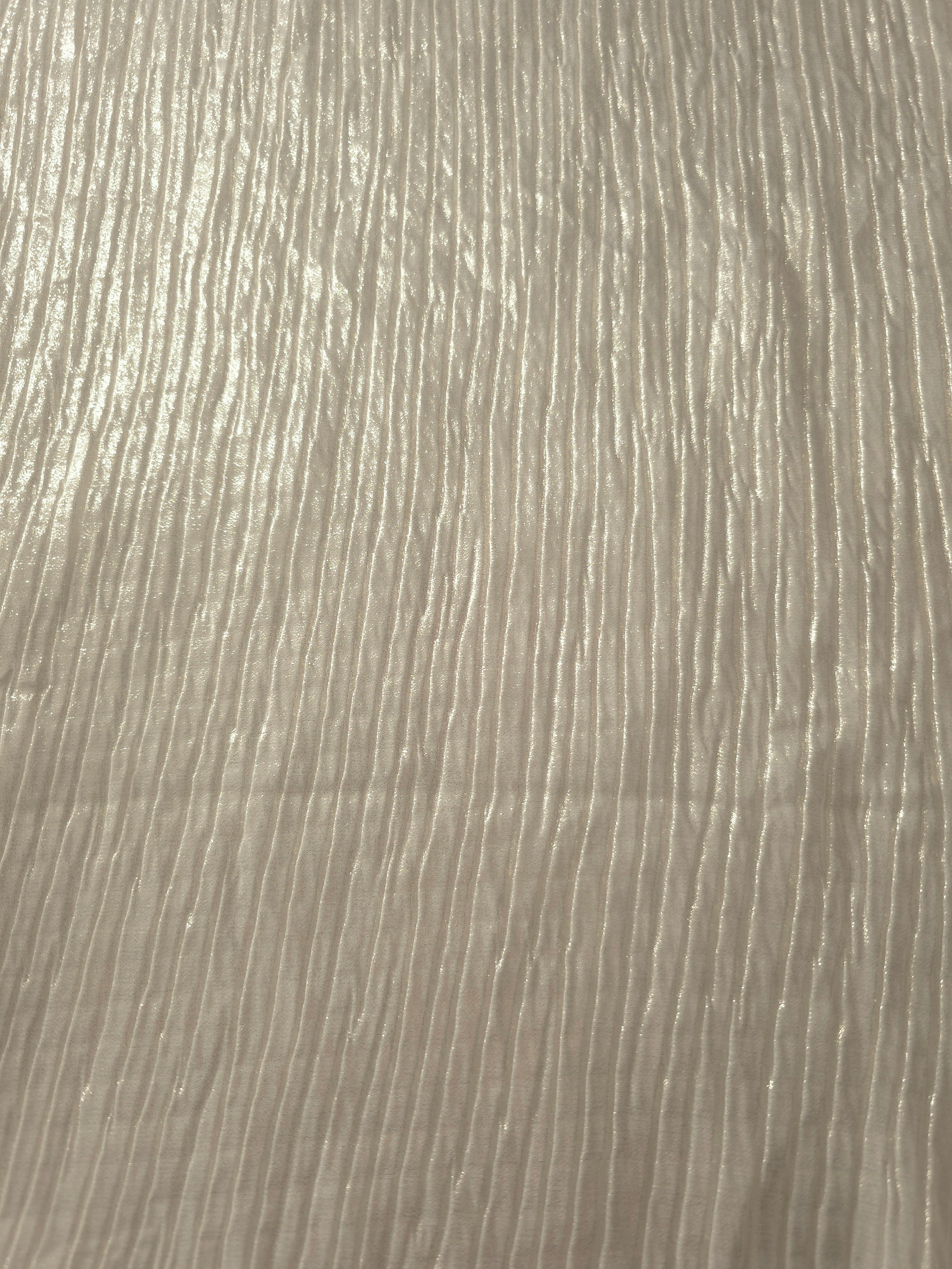 Surface detail of Ivory Cream classic plissé shimmer fabric showcases regular pleated texture for evening clutches, garment accents and special-occasion pieces.