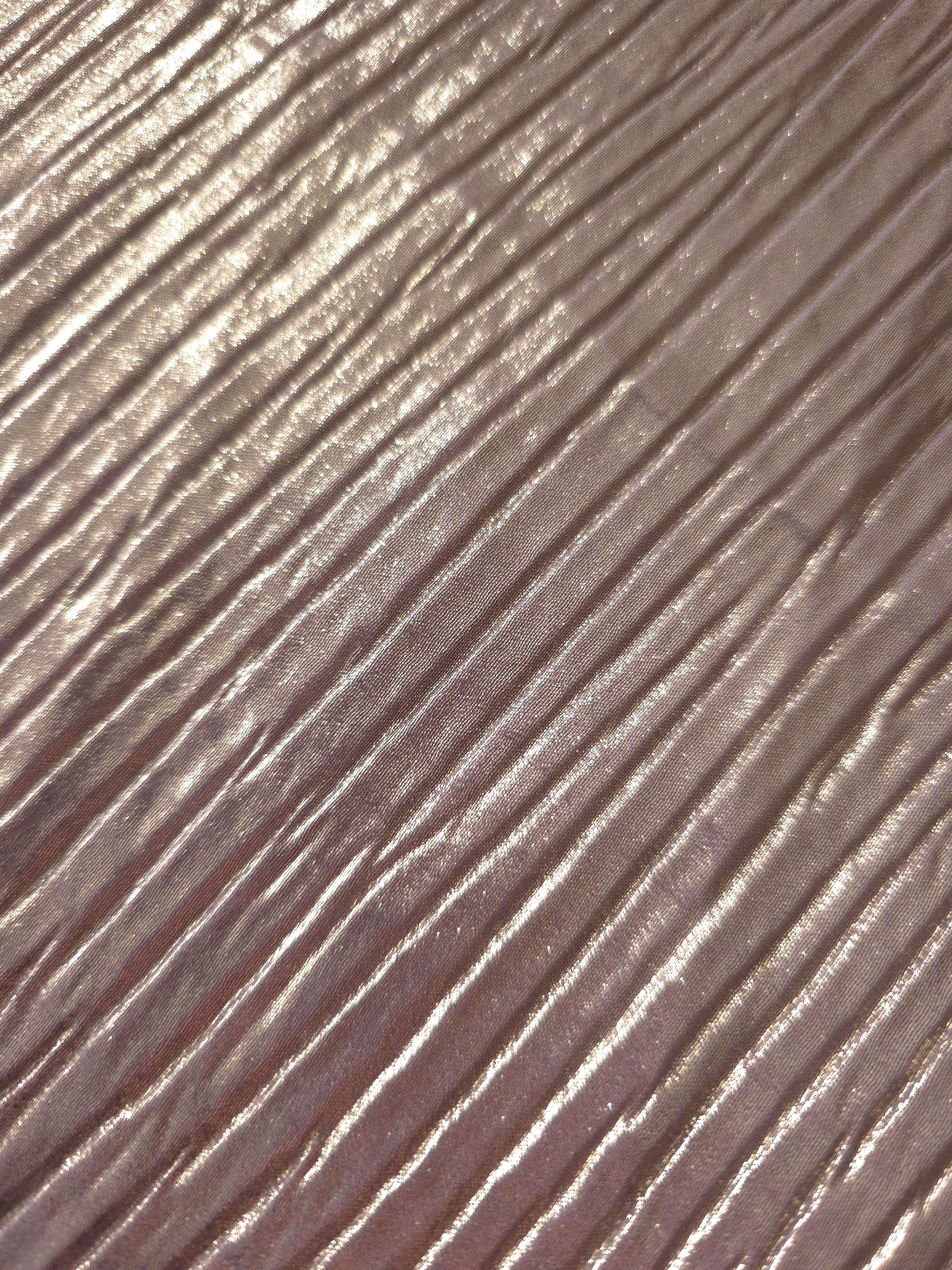 Soft drape of Lavender Taupe textured shimmer plissé reveals dimensional folds and shifting reflection for jumpsuits and fluid occasionwear.