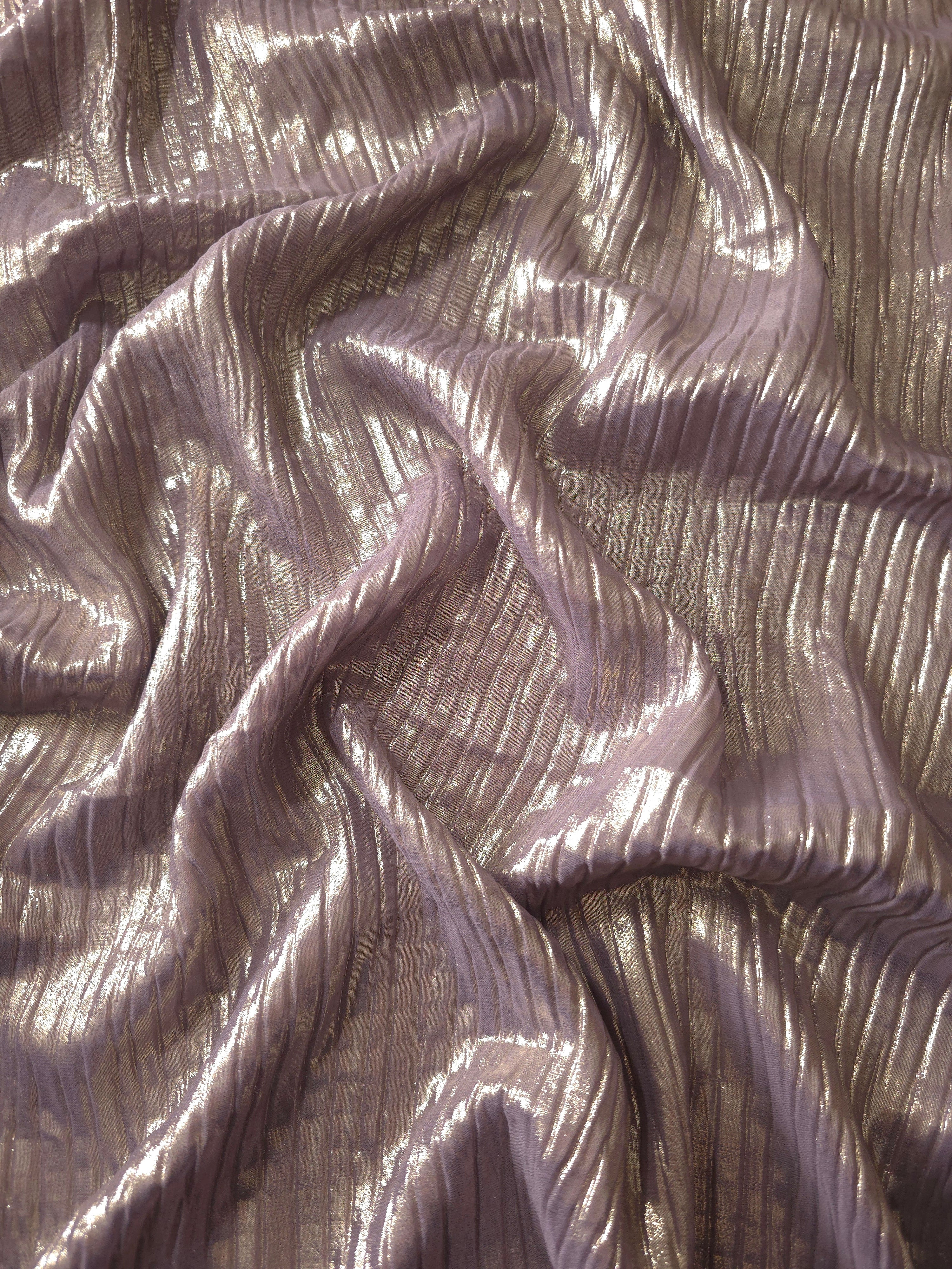 Flowing drape of Lavender Taupe classic plissé shimmer fabric, showing regular pleated texture and light-catching movement for evening gowns and flowing maxi skirts.