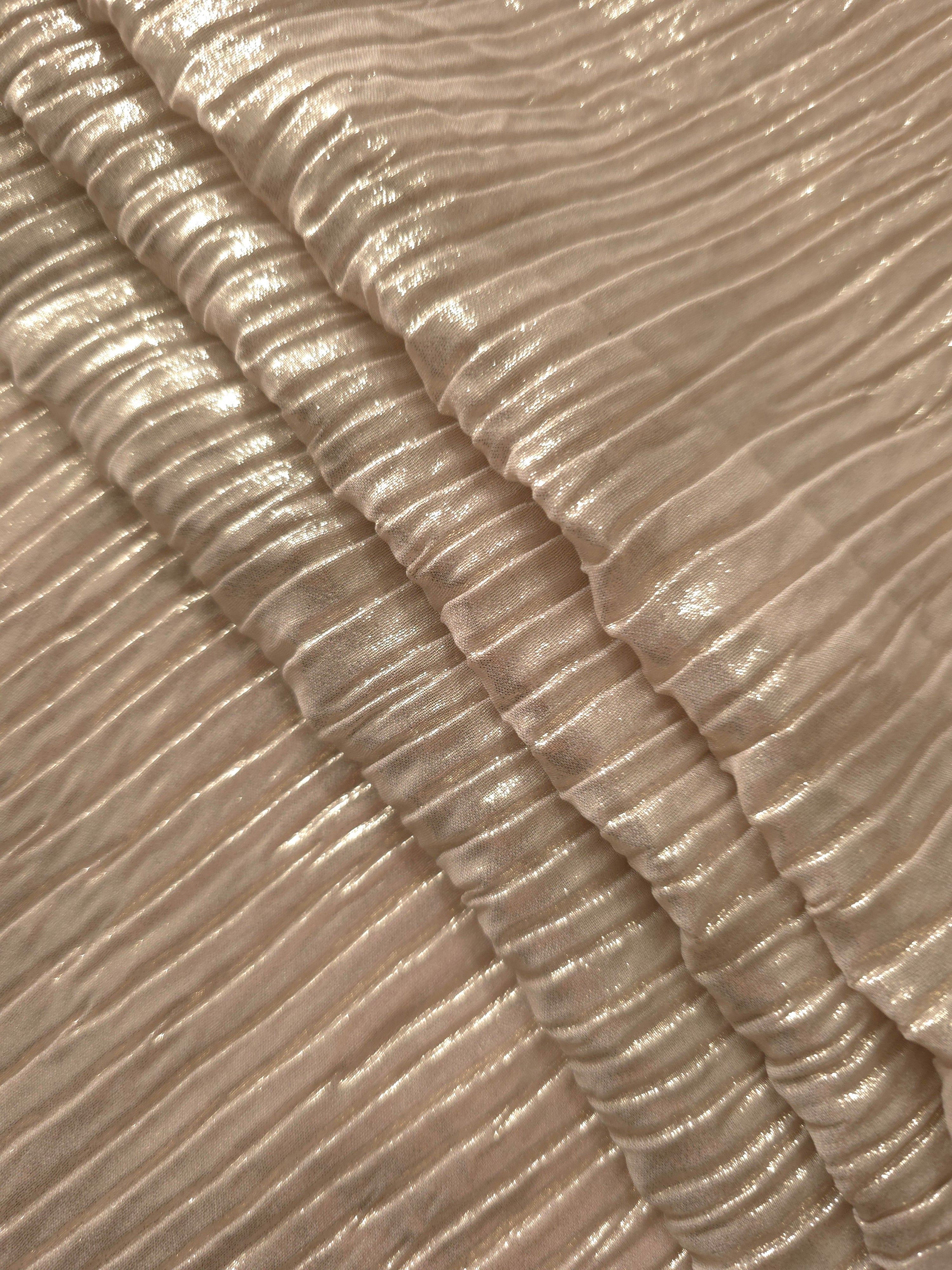Light Cream classic plissé fabric in close detail, revealing the fine shimmer and dimensional pleat structure suited to bodice accents and fashion-forward blouses.