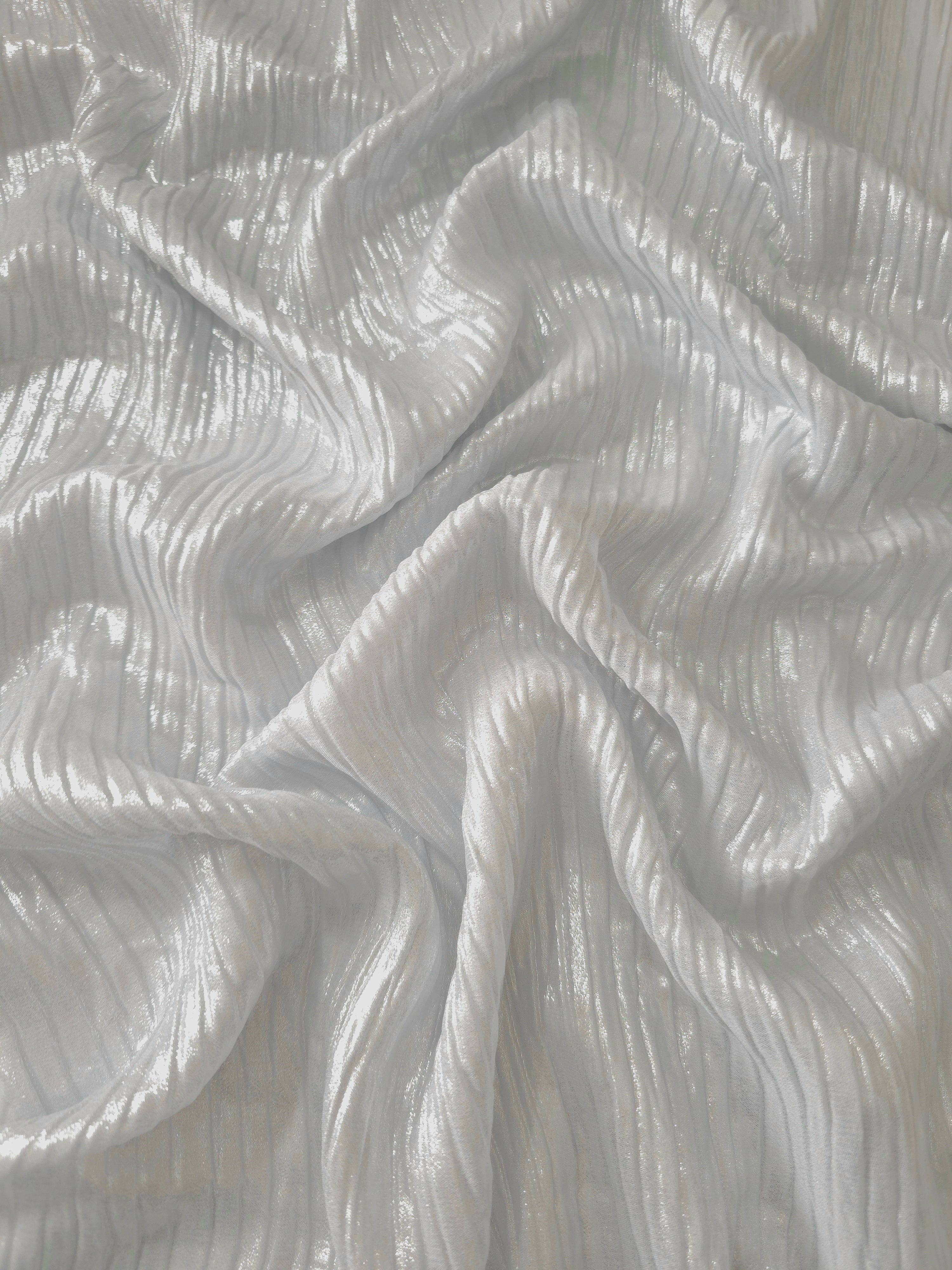 Flowing drape of Pearl Gray classic plissé shimmer fabric, showing regular pleated texture and light-catching movement for evening gowns and flowing maxi skirts.