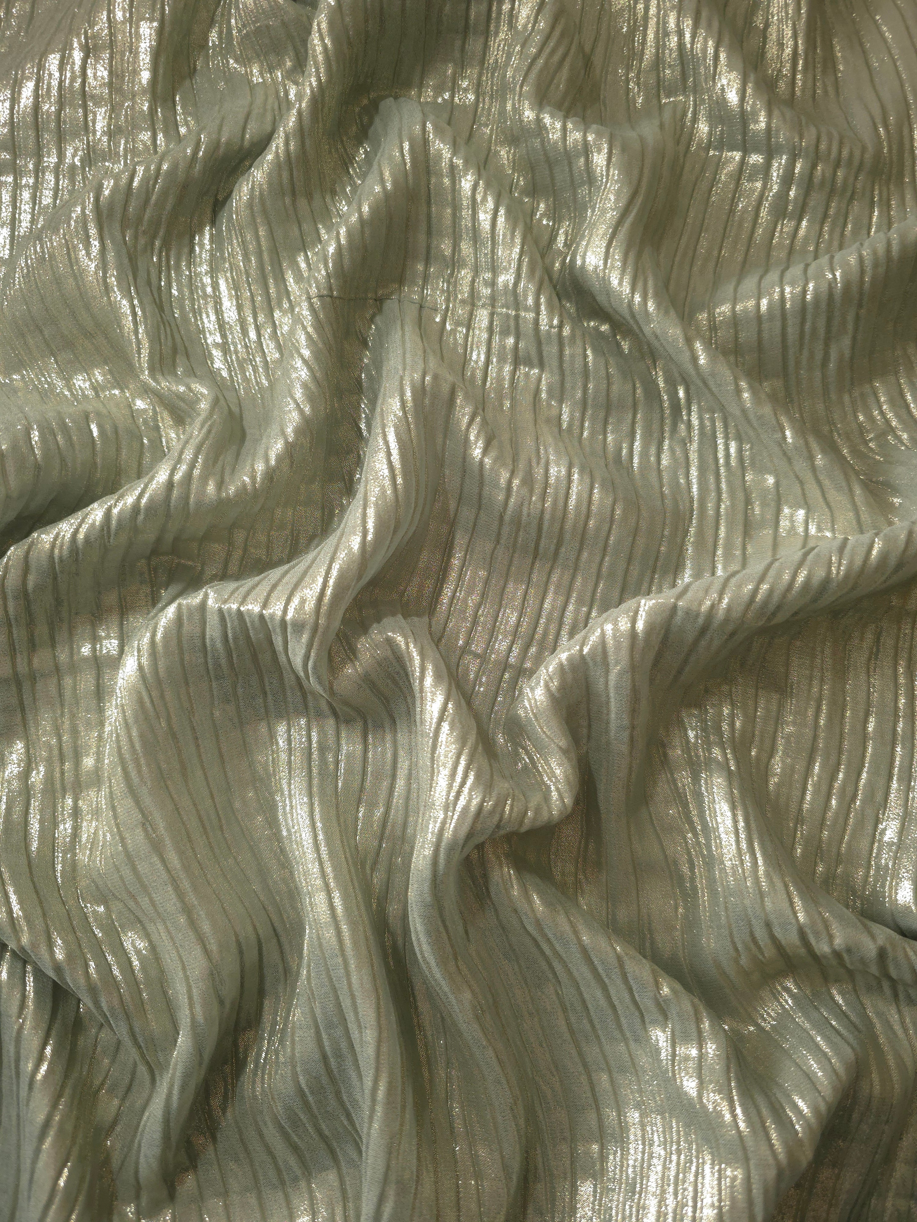 Flowing drape of Sage Taupe classic plissé shimmer fabric, showing regular pleated texture and light-catching movement for evening gowns and flowing maxi skirts.