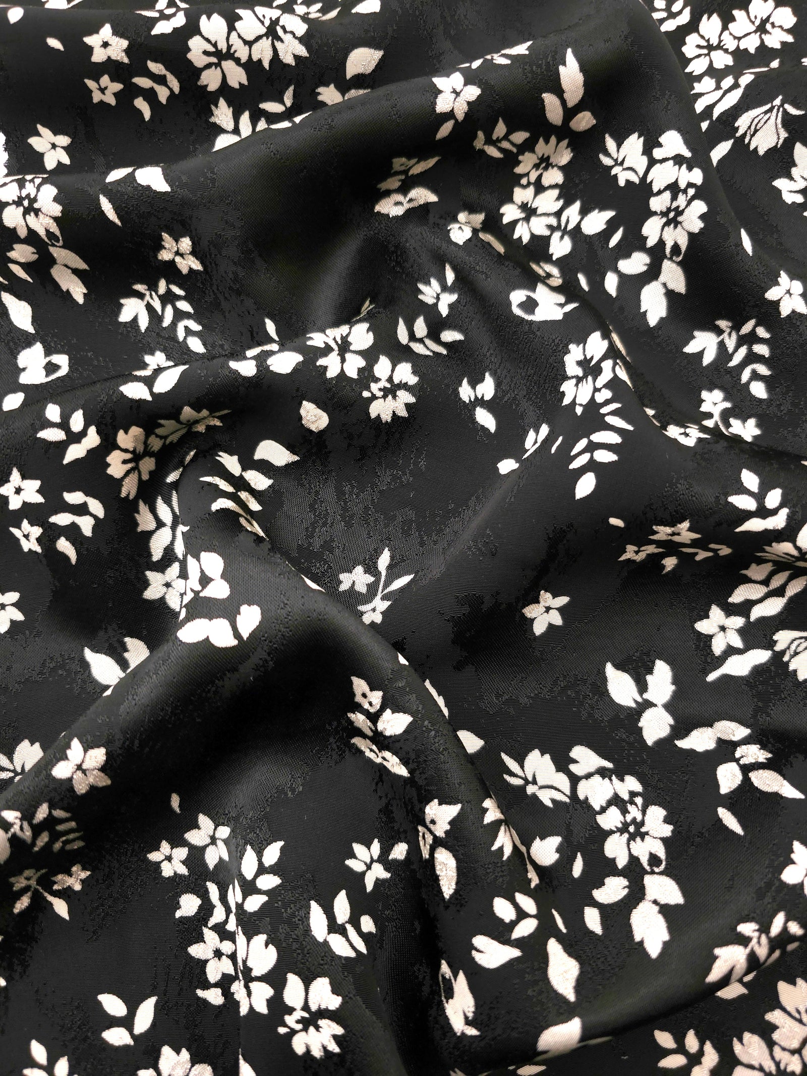 Ivory wildflower scatter Turkish rayon viscose jacquard fabric on black base