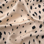 Black pebble scatter Turkish rayon viscose jacquard fabric on ivory white base