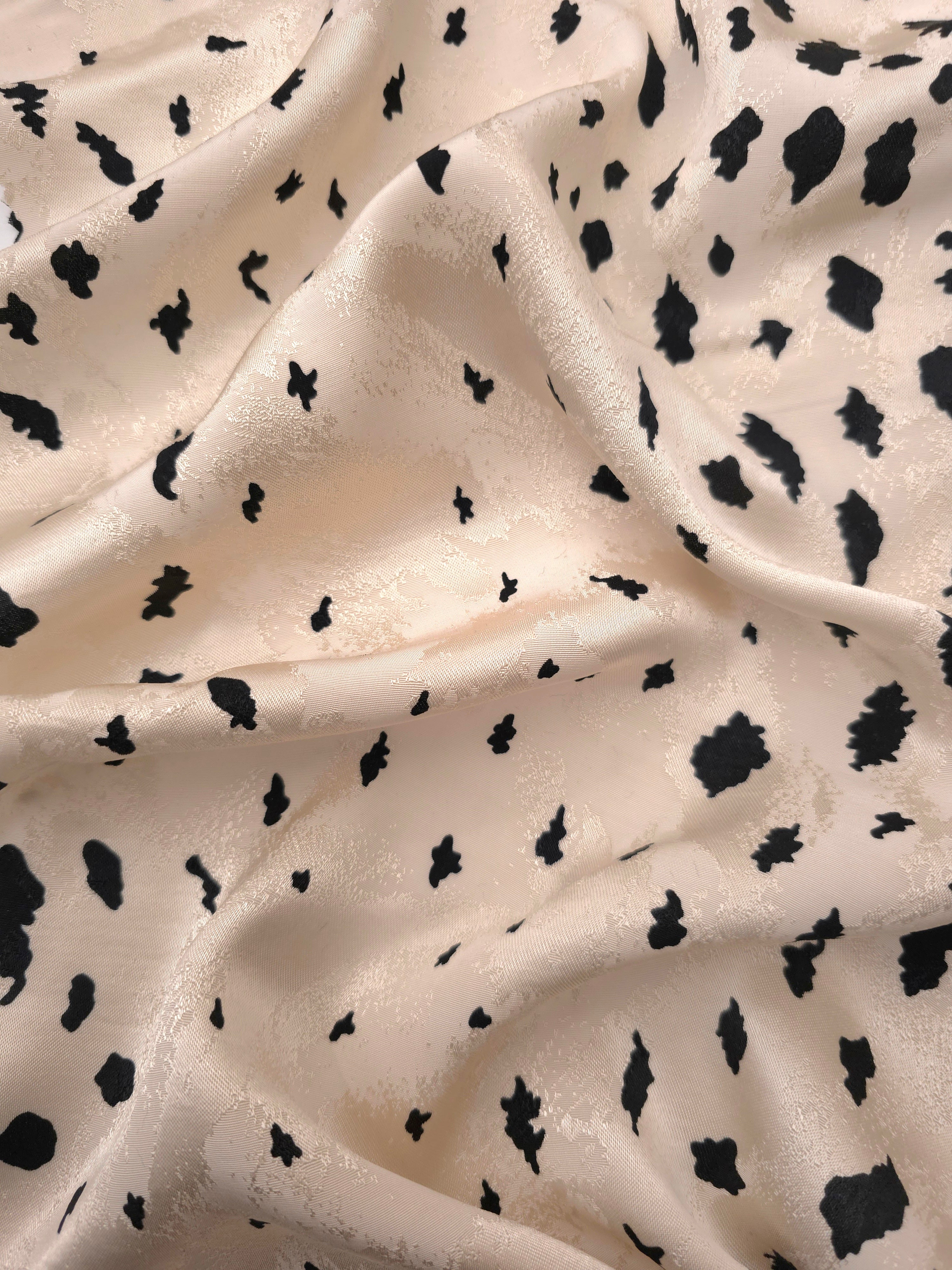 Black pebble scatter Turkish rayon viscose jacquard fabric on ivory white base
