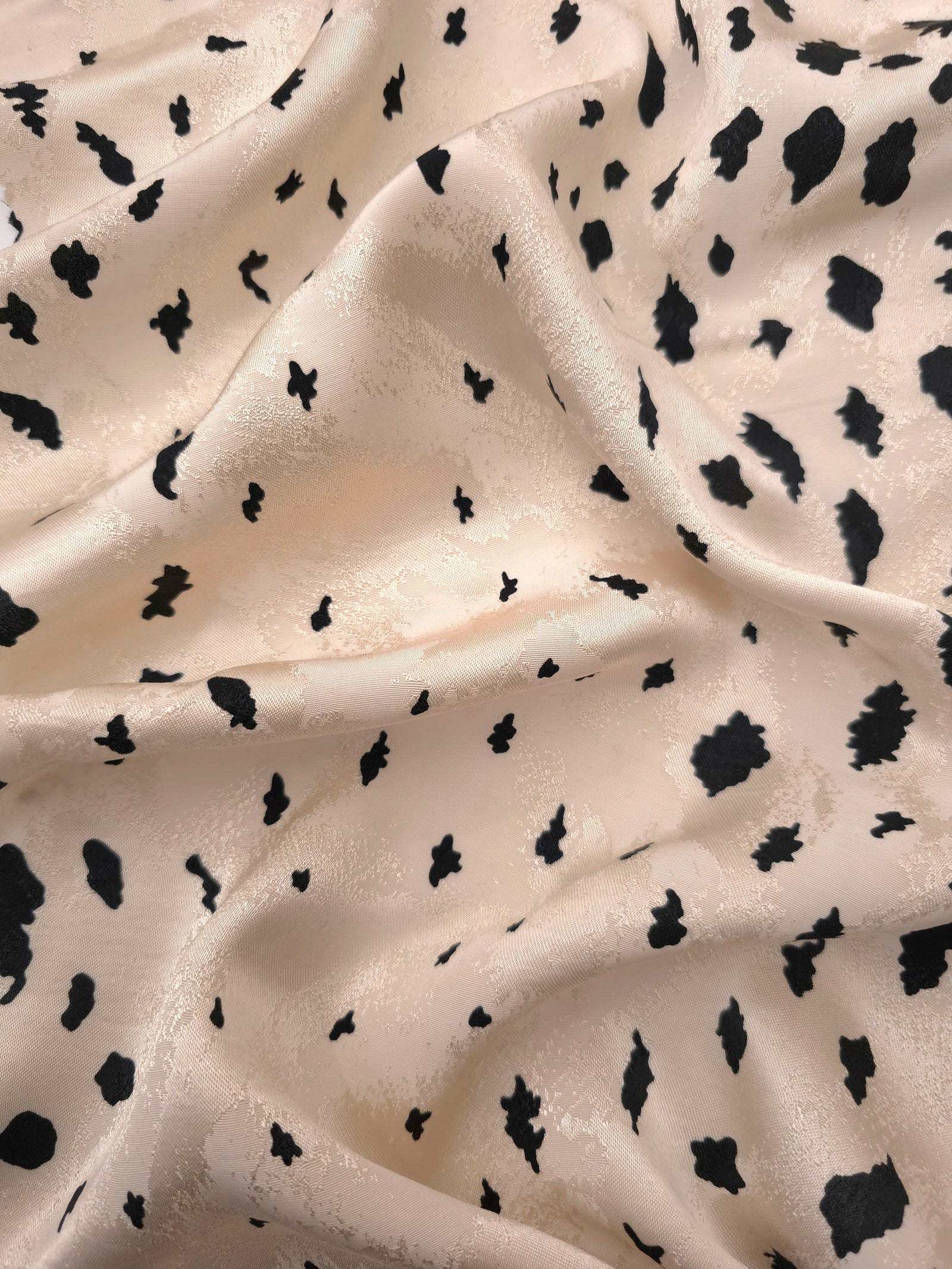 Black pebble scatter Turkish rayon viscose jacquard fabric on ivory white base
