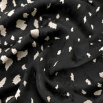Ivory pebble scatter Turkish rayon viscose jacquard fabric on black base