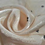 Close-up of draped Flower printed jacquard fabric showing fold detail