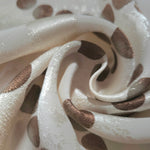 Close-up of draped Polka Dot Chain printed jacquard fabric showing fold detail