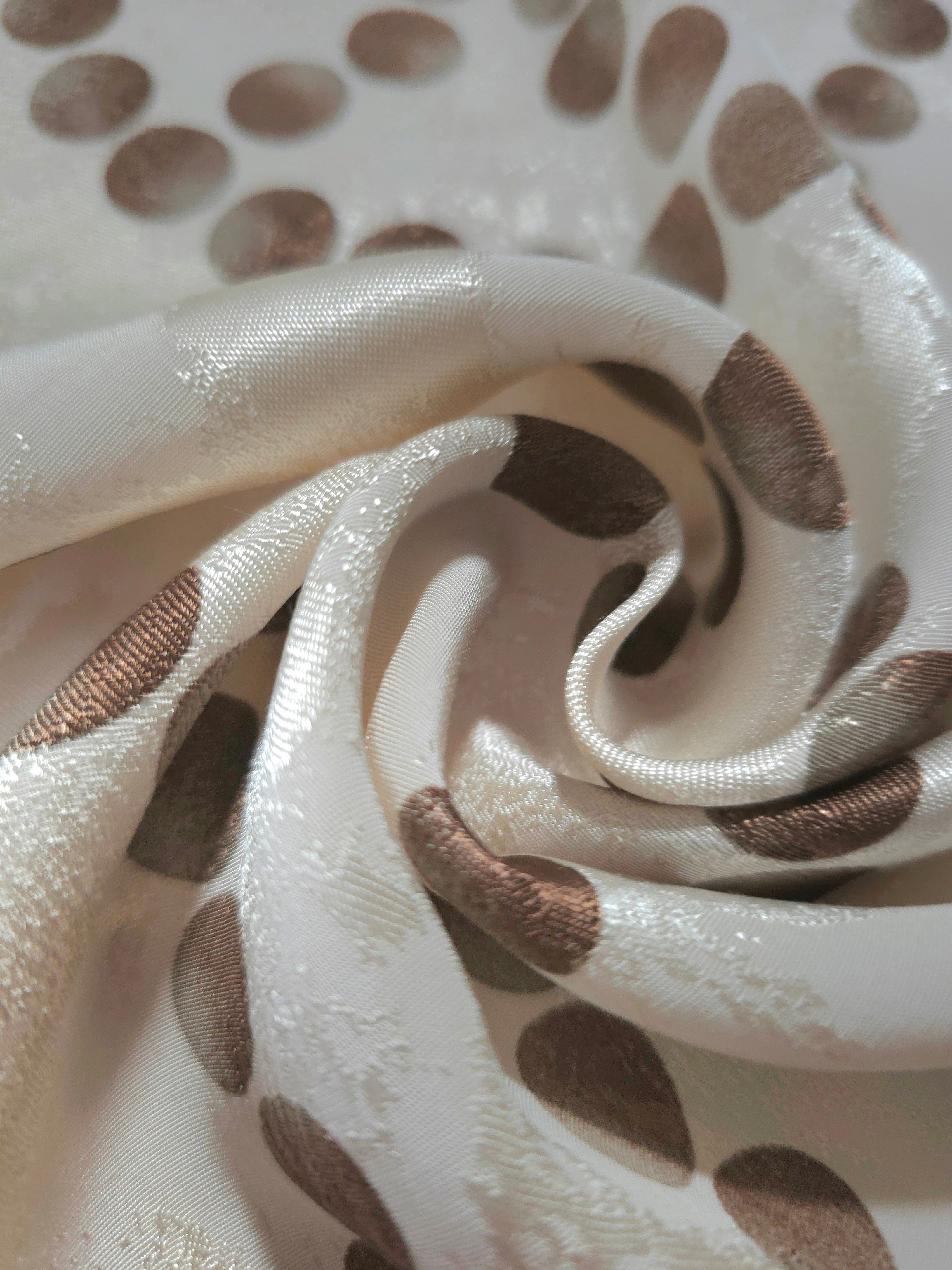 Close-up of draped Polka Dot Chain printed jacquard fabric showing fold detail