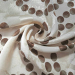 Polka Dot Chain rotary print on Turkish jacquard fabric, draped showing fluid movement