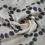 Polka Dot Chain rotary print on Turkish jacquard fabric, draped showing fluid movement