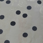 Close-up of Polka Dot rotary print on Turkish rayon-viscose jacquard fabric