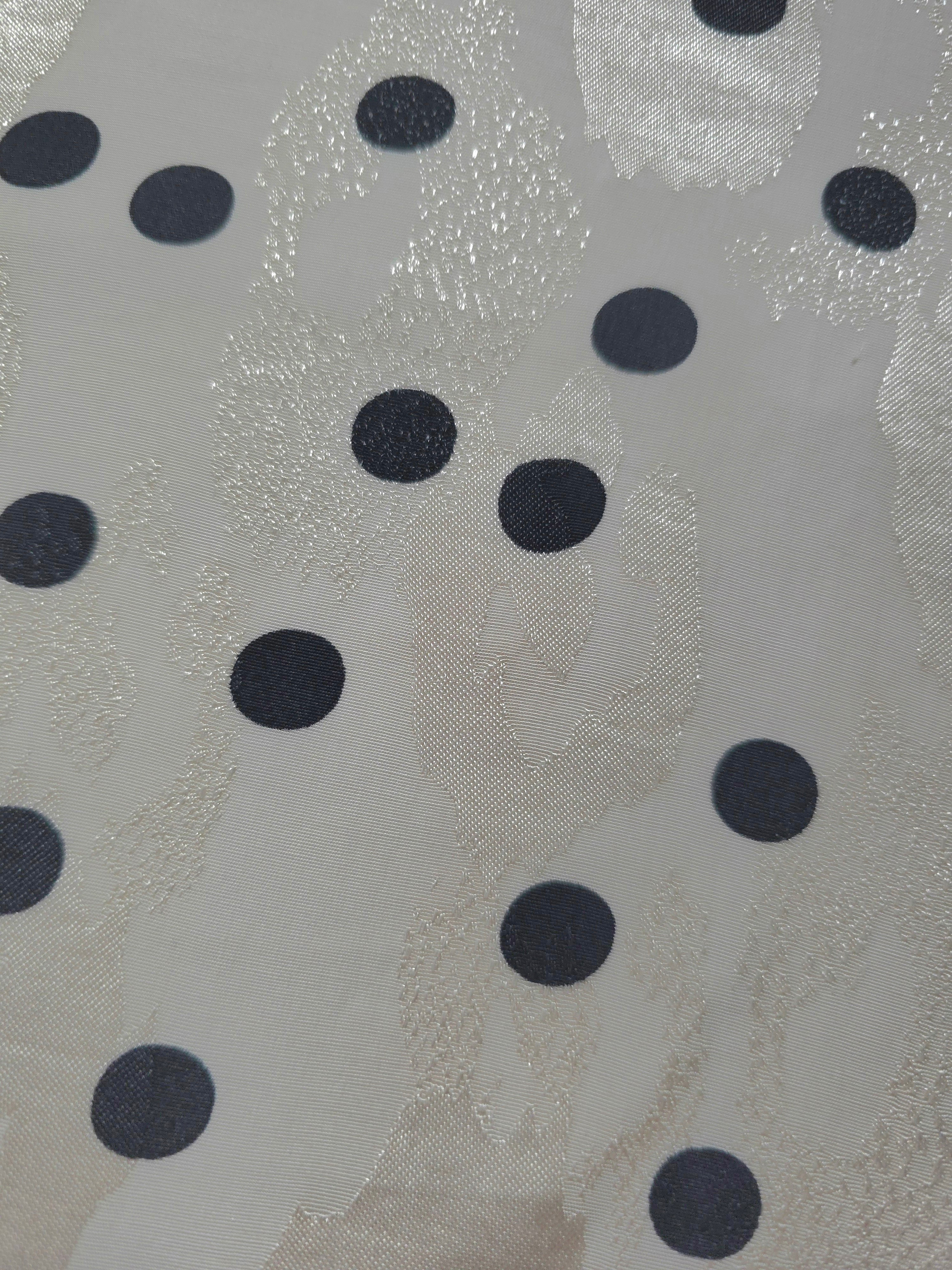 Close-up of Polka Dot rotary print on Turkish rayon-viscose jacquard fabric
