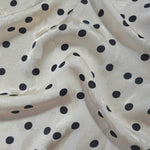 Polka Dot printed jacquard fabric in a wave fold, showing print and texture
