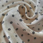 Close-up of draped Small Flower printed jacquard fabric showing fold detail