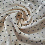 Small Flower rotary print on Turkish jacquard fabric, draped showing fluid movement