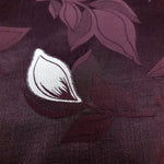 Close texture of two-tone viscose jacquard with embossed woven surface.