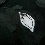 Close texture of viscose embossed two-tone jacquard with raised detail.