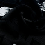 Close drape of two-tone viscose jacquard showing textured woven surface.