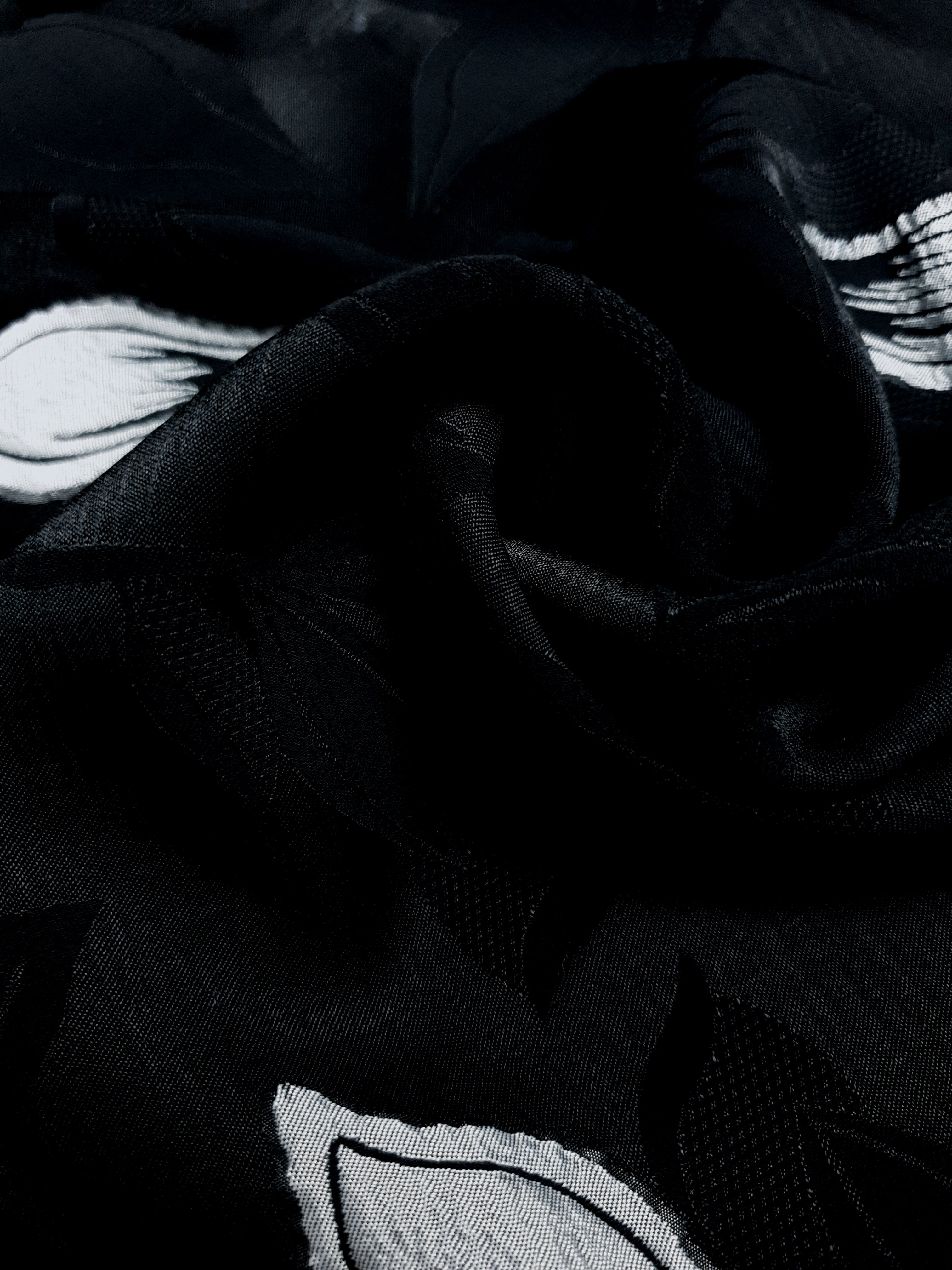 Close drape of two-tone viscose jacquard showing textured woven surface.
