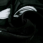 Close drape of viscose embossed jacquard showing soft woven movement.