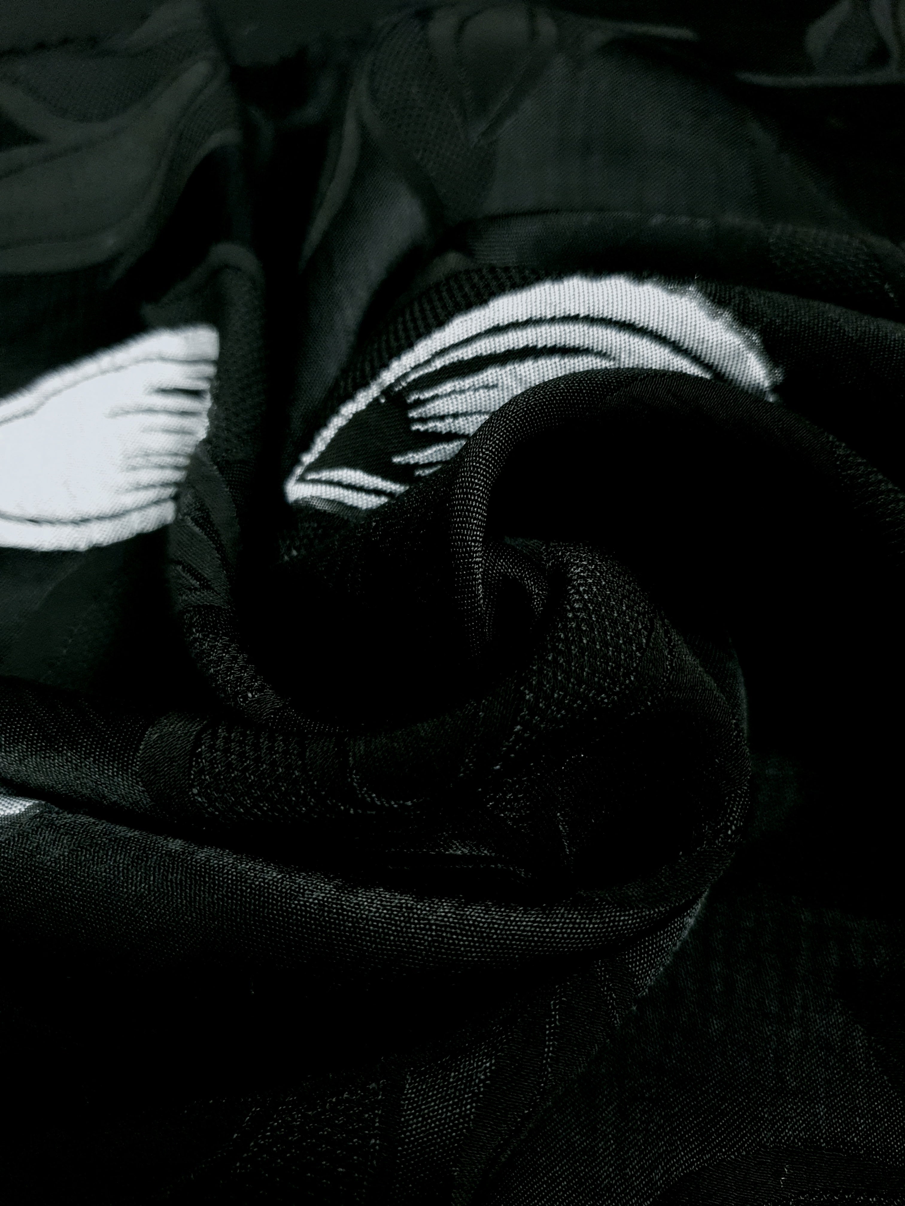 Close drape of viscose embossed jacquard showing soft woven movement.