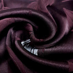 Close drape detail of viscose embossed jacquard with soft texture.