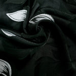 Drape shot of viscose embossed two-tone jacquard fabric for skirts.