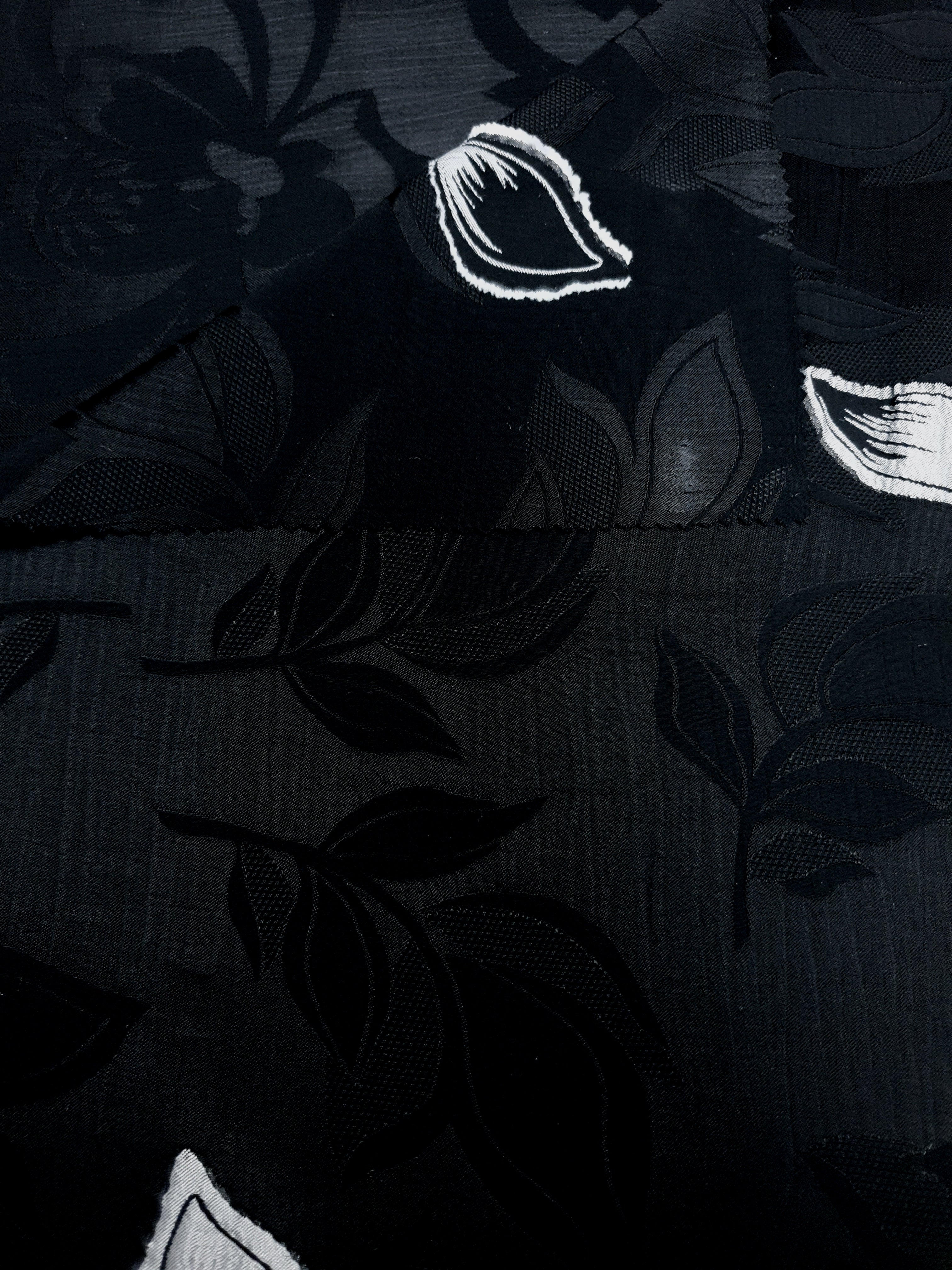 Front and back view of viscose embossed jacquard for lining decisions.
