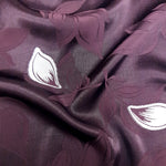 Wave drape shot of two-tone viscose jacquard for flowing garments.