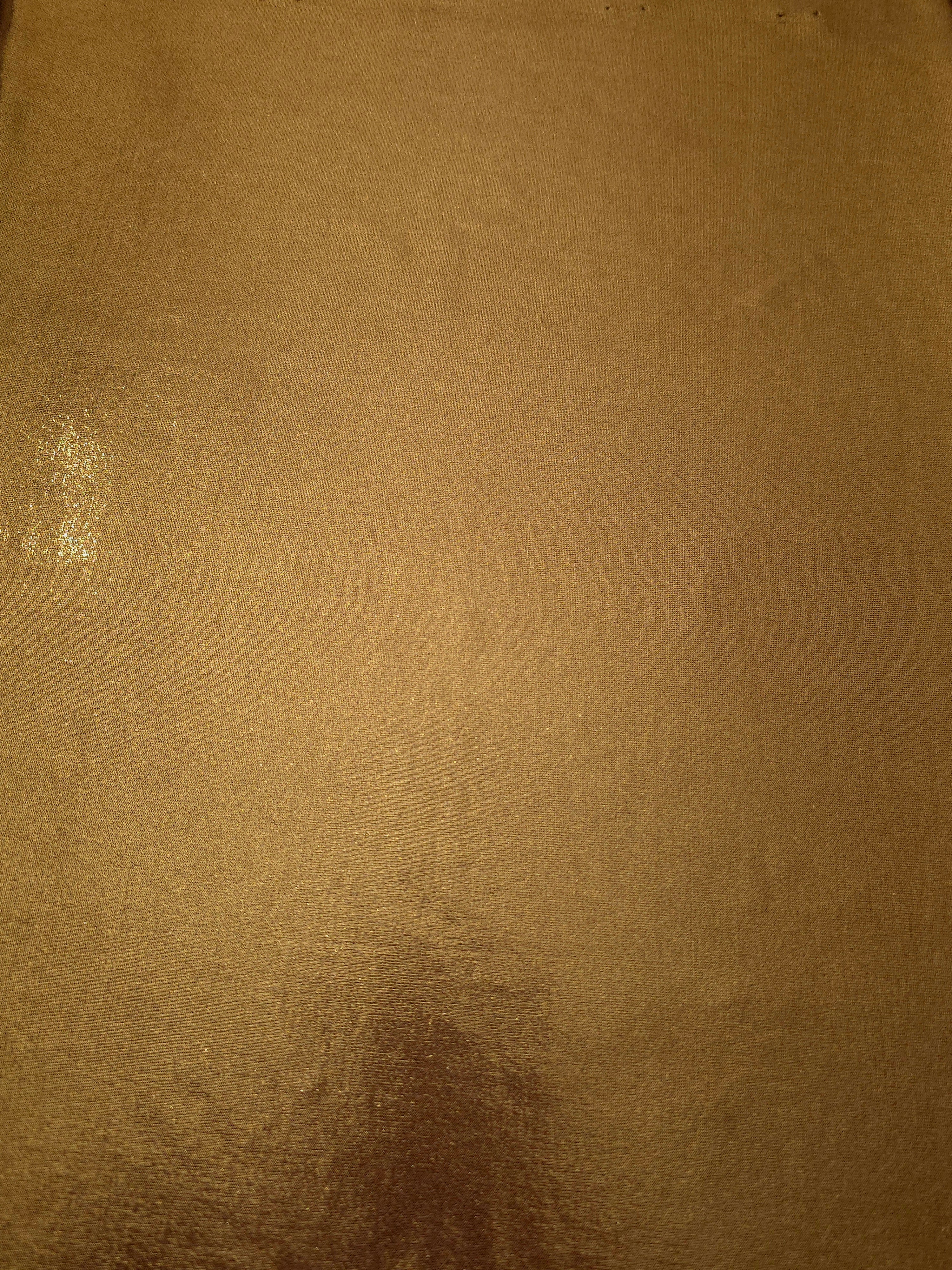 Full surface of Antique Bronze metallic stretch fabric, highlighting luminous foil sheen for stage costumes, dresses and fashion design
