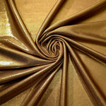 Spiraled Antique Bronze shimmer spandex fabric showing reflective movement for evening dresses, costumes and performance apparel